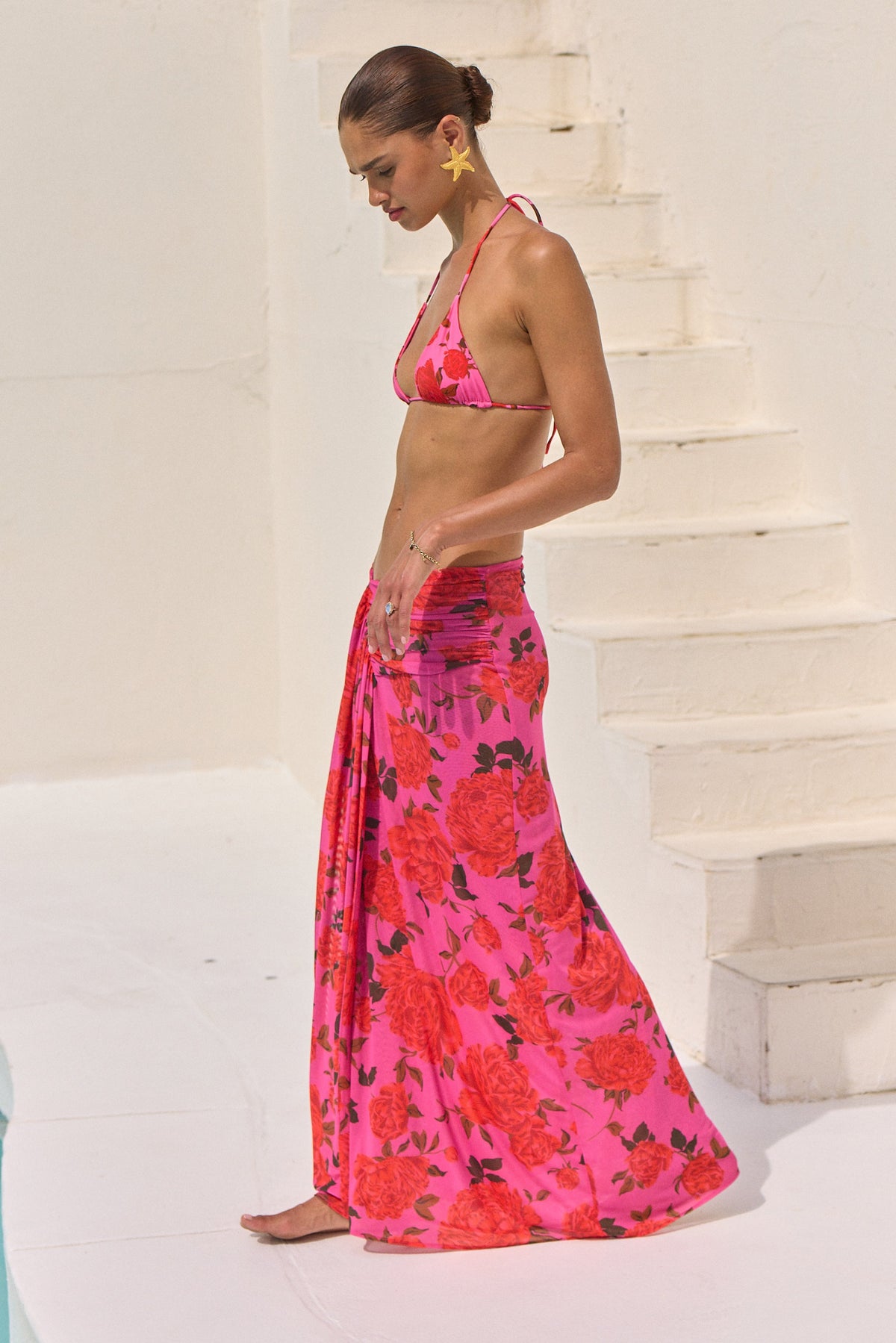This is an image of Estelle Skirt in Rosebud - RESA featuring a model wearing the dress