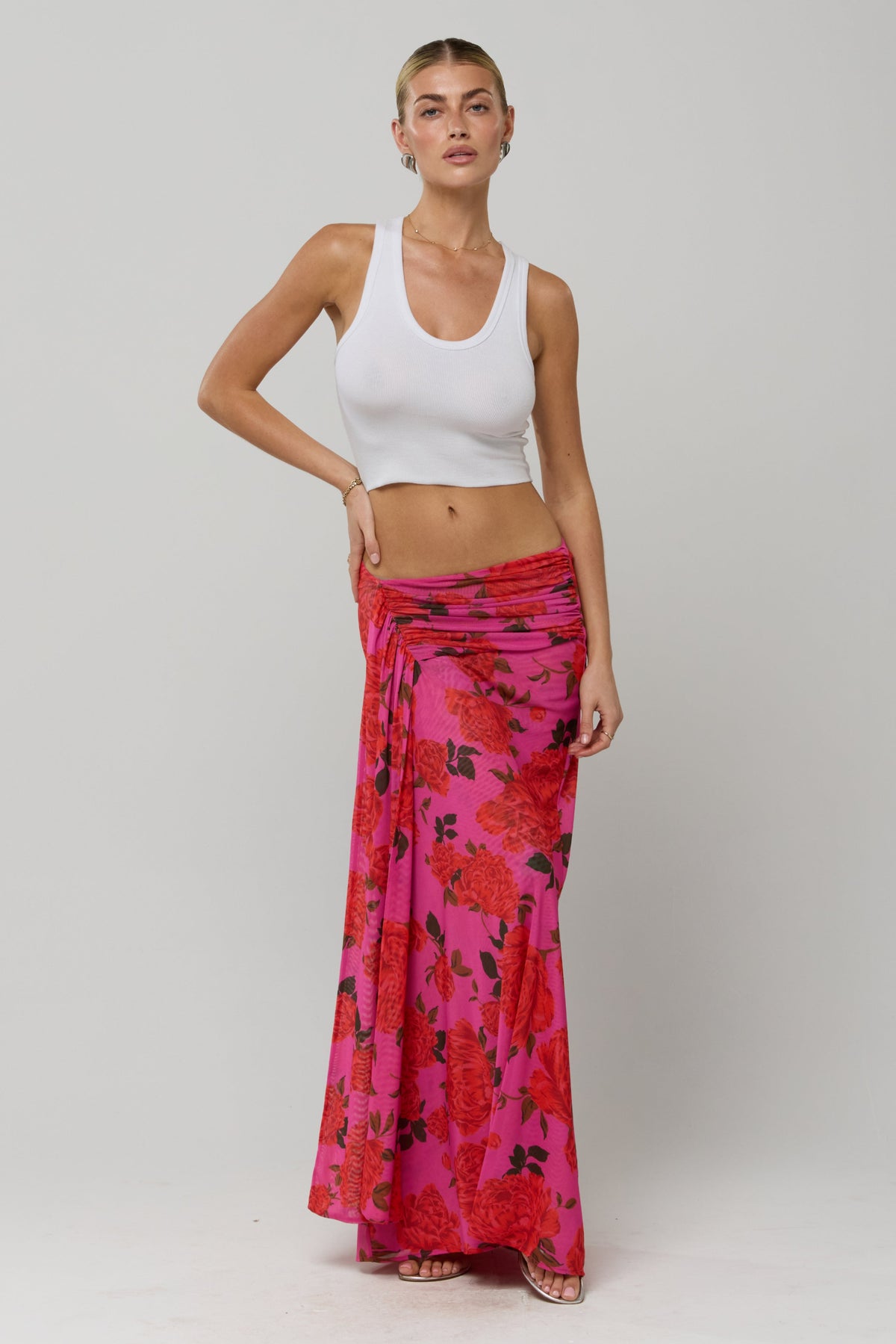 This is an image of Estelle Skirt in Rosebud - RESA featuring a model wearing the dress