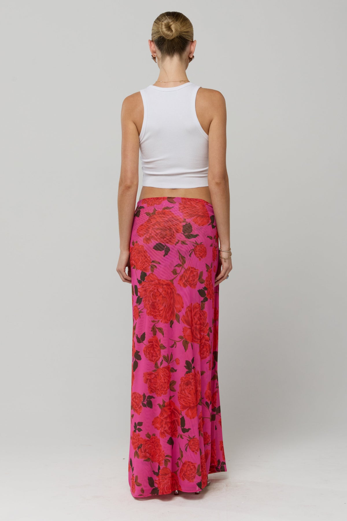 This is an image of Estelle Skirt in Rosebud - RESA featuring a model wearing the dress