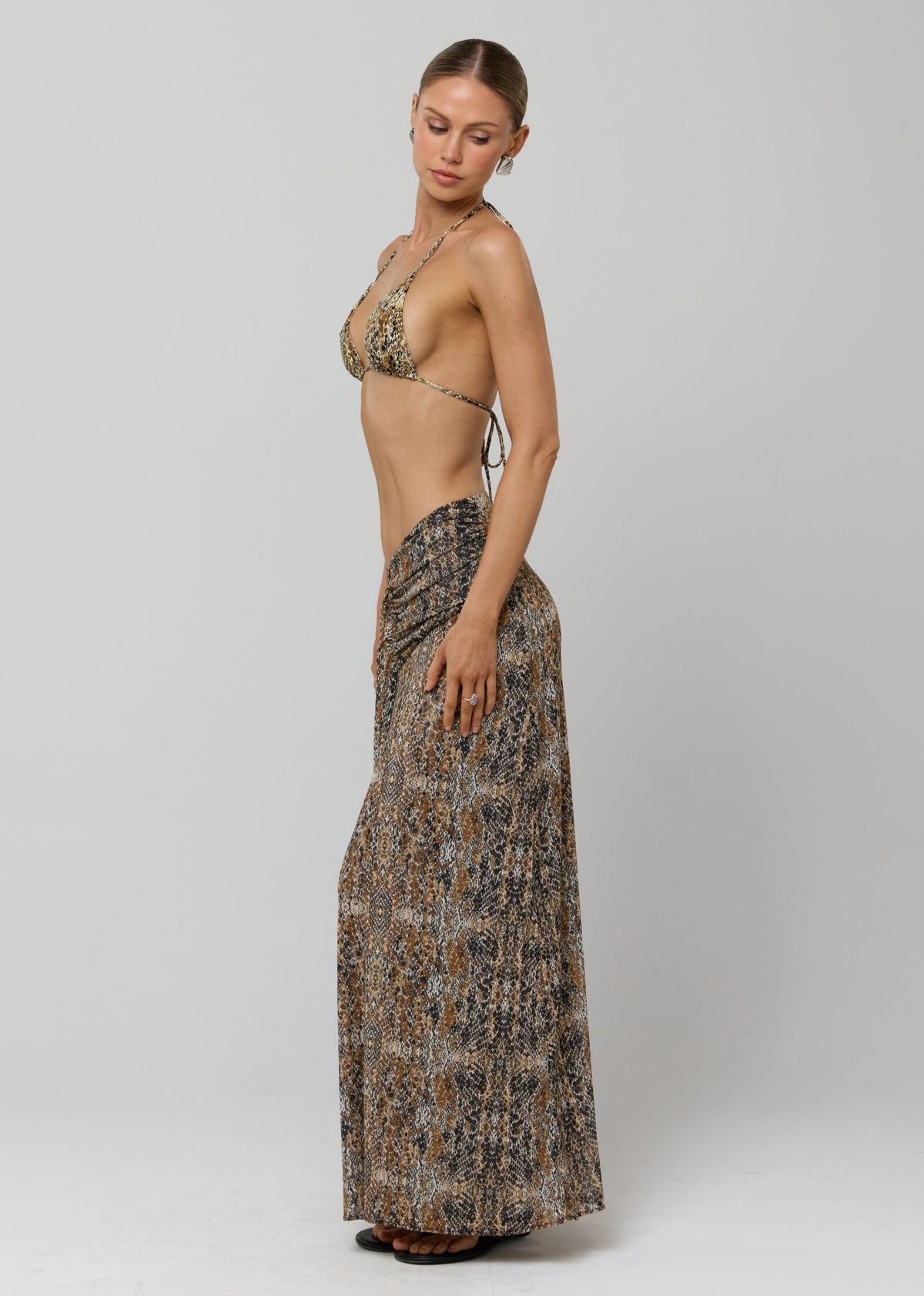 This is an image of Estelle Skirt in Serpent - RESA featuring a model wearing the dress