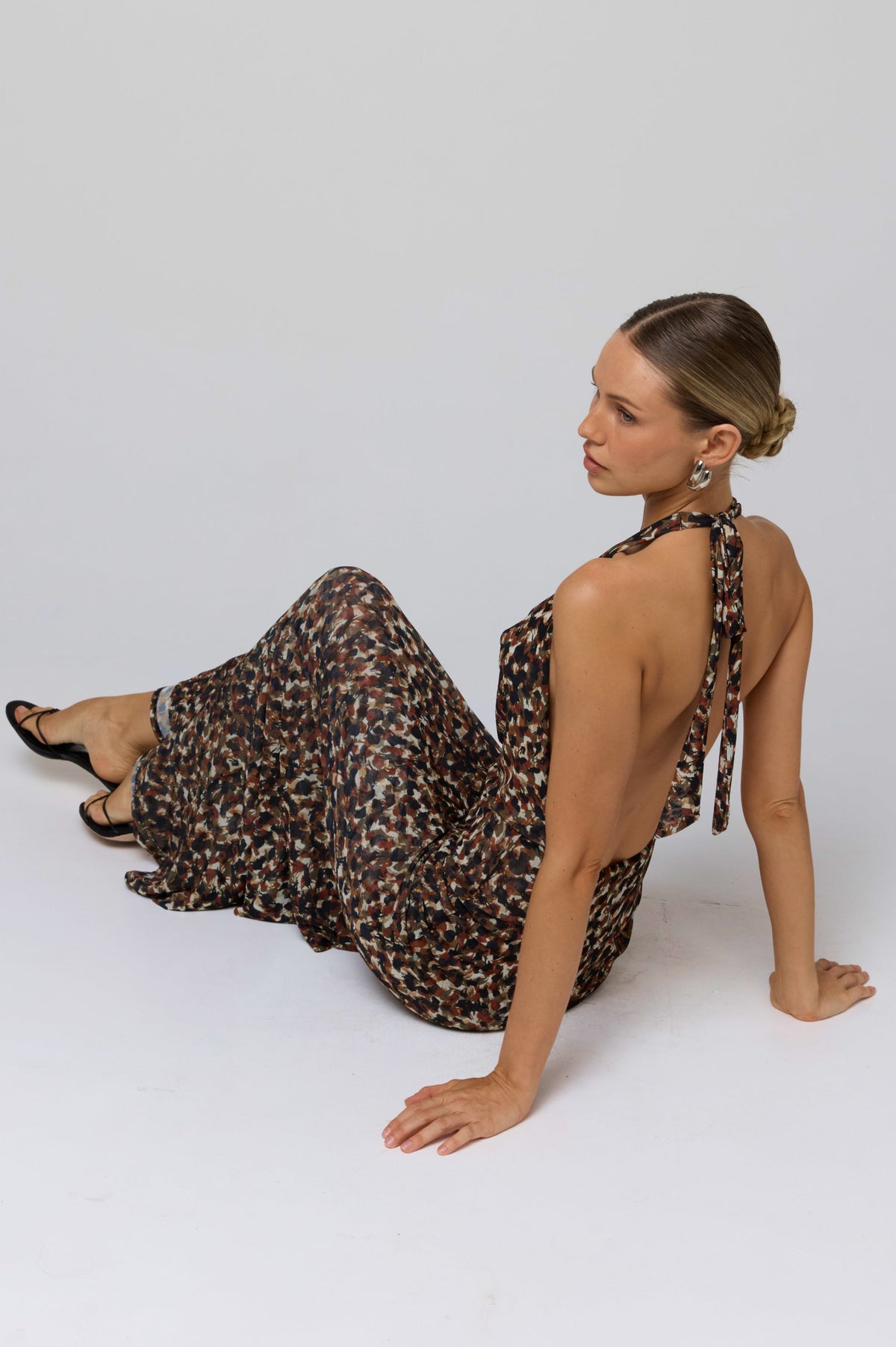 This is an image of Fiona Dress in Terra - RESA featuring a model wearing the dress