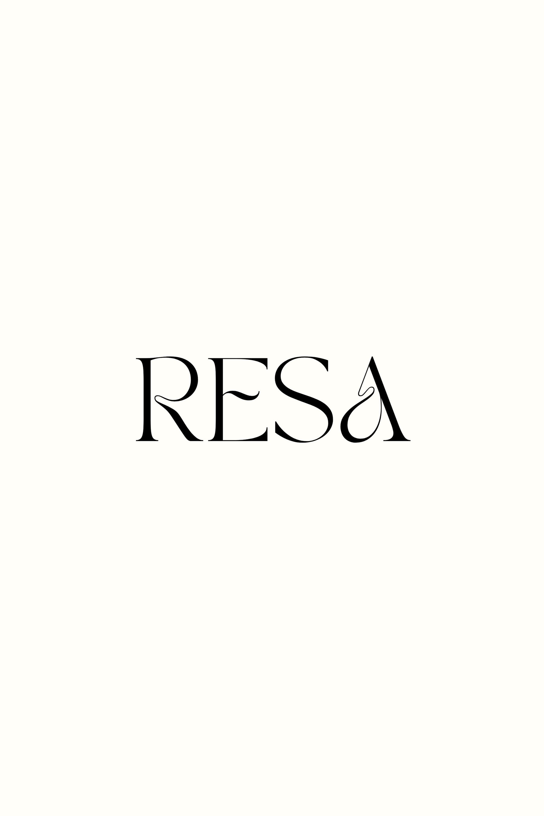This is an image of Free Returns Shipping + Package Protection - RESA featuring a model wearing the dress