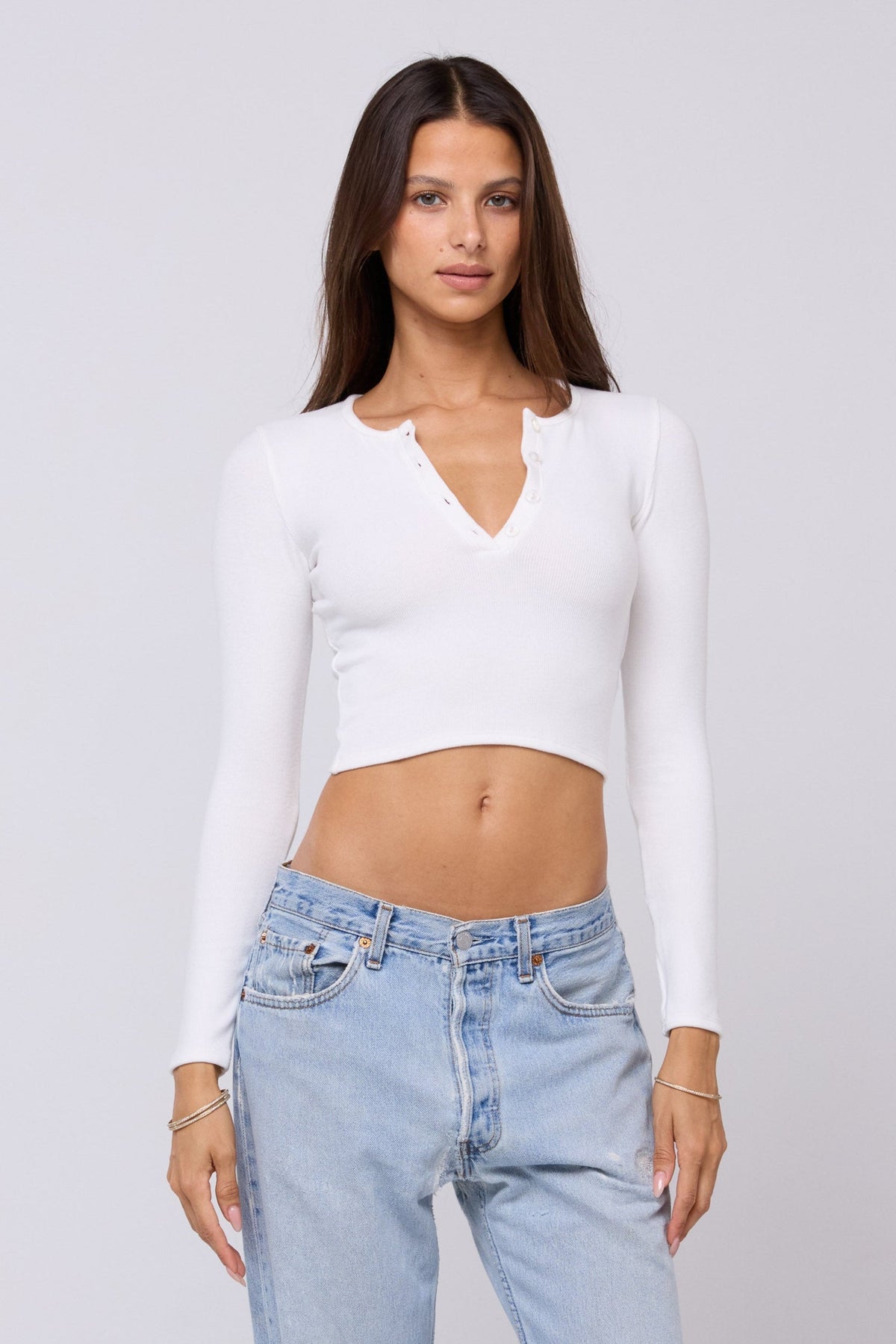 This is an image of Henley Rib in White - RESA featuring a model wearing the dress