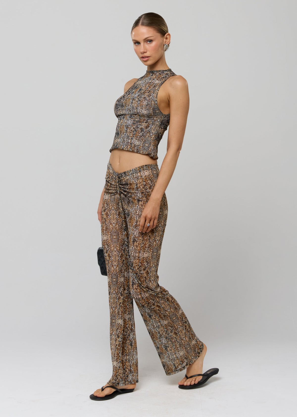 This is an image of Jess Top in Serpent - RESA featuring a model wearing the dress