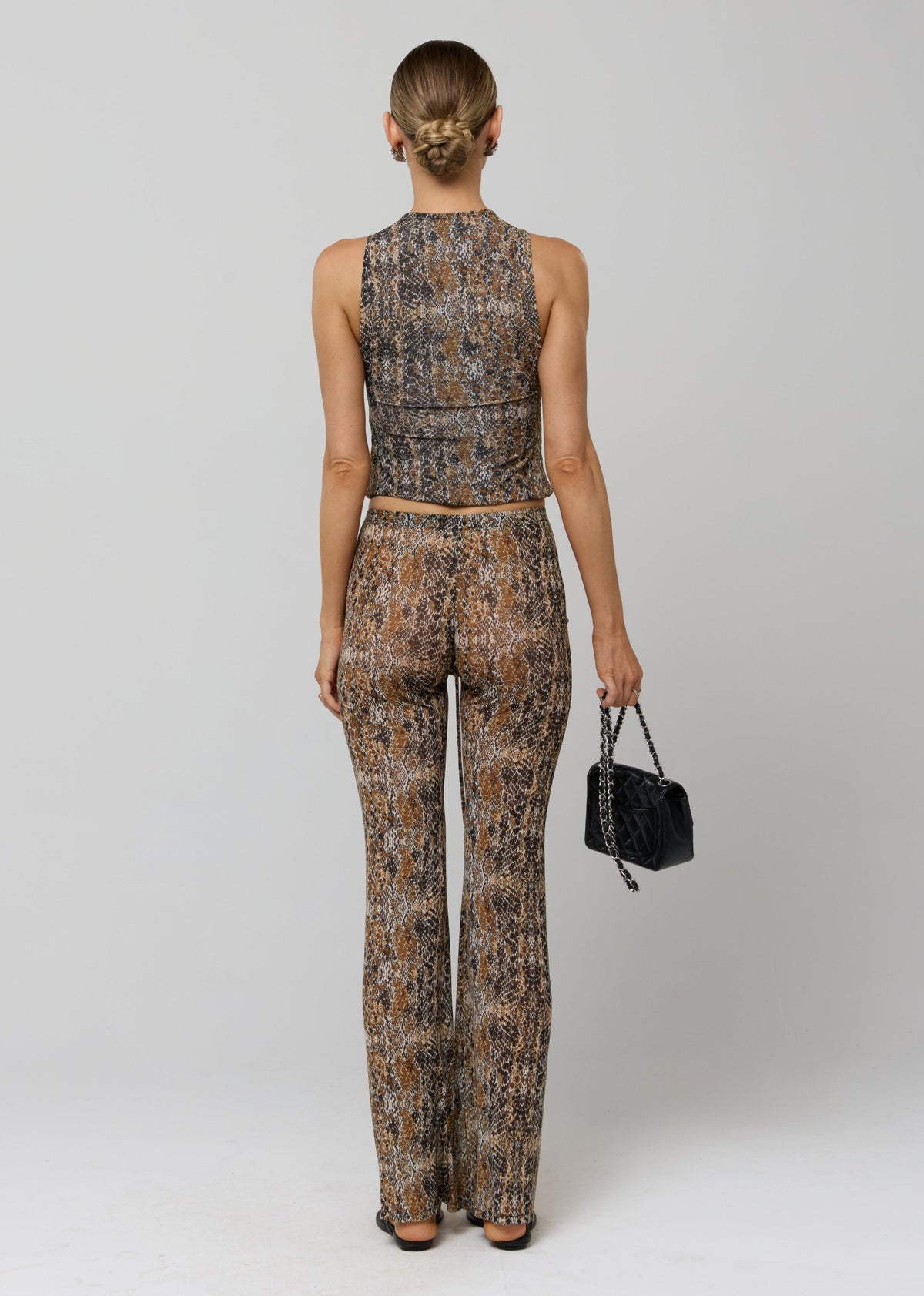 This is an image of Jess Top in Serpent - RESA featuring a model wearing the dress