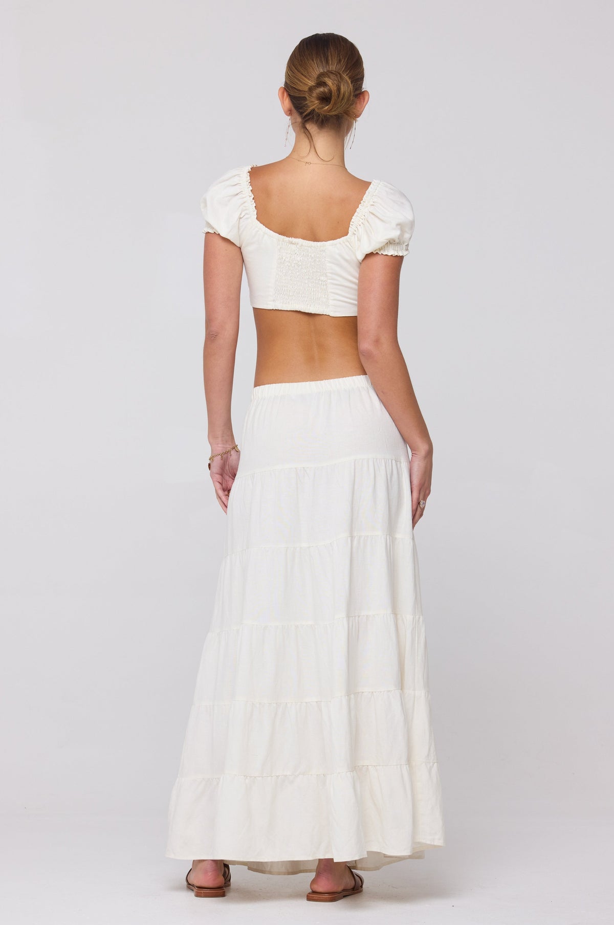 This is an image of Jess Top in White Linen - RESA featuring a model wearing the dress