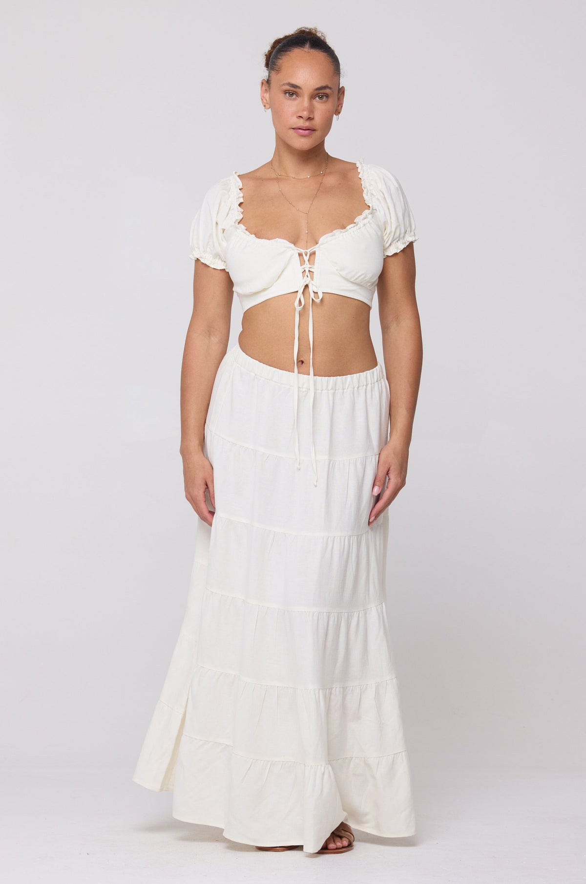 This is an image of Jess Top in White Linen - RESA featuring a model wearing the dress