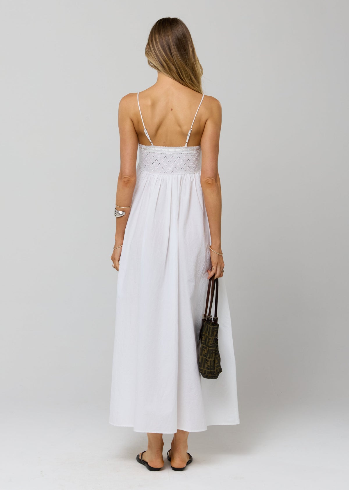 This is an image of Kira Dress in White Eyelet - RESA featuring a model wearing the dress