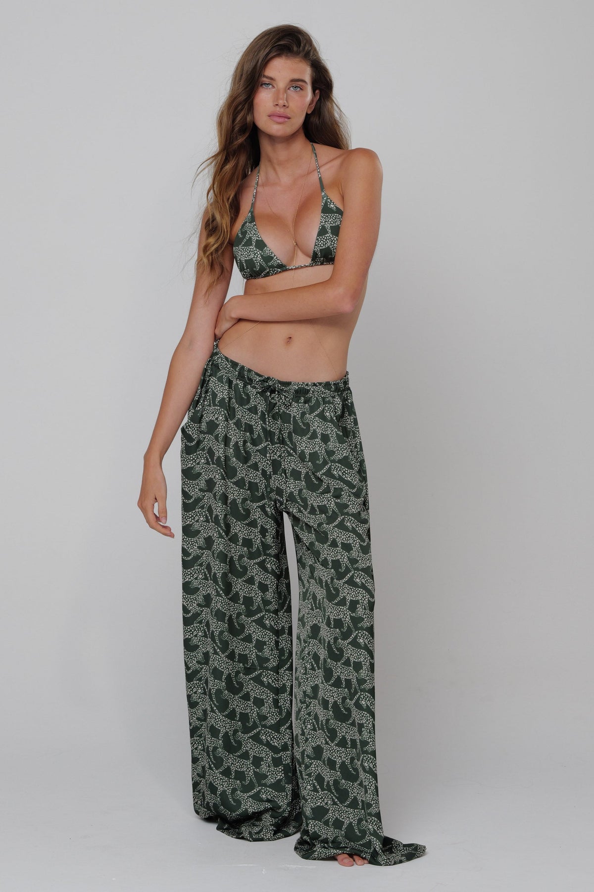 This is an image of Kyle Bikini Top in Puma - RESA featuring a model wearing the dress