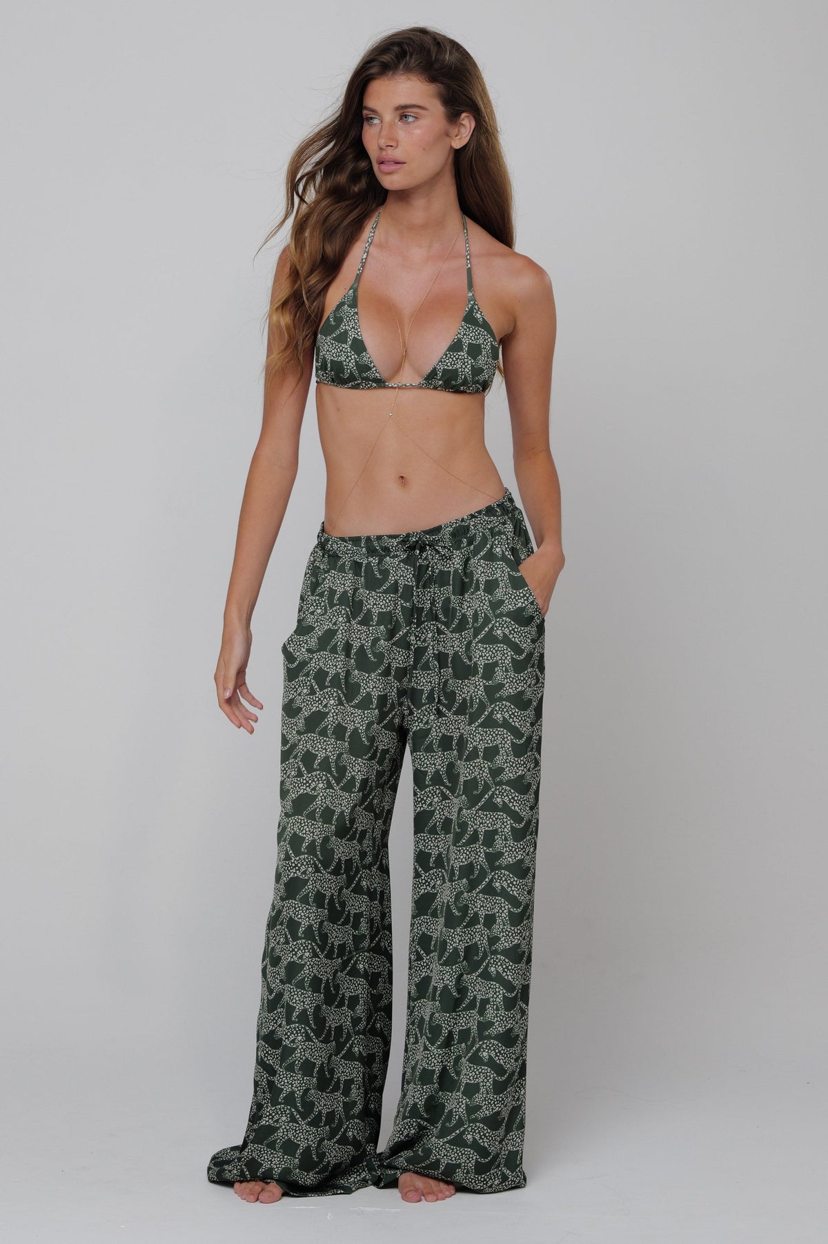 This is an image of Kyle Bikini Top in Puma - RESA featuring a model wearing the dress