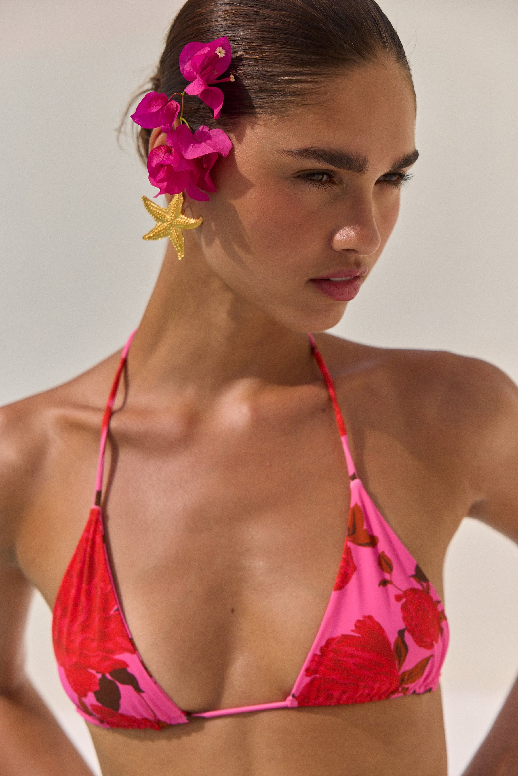 This is an image of Kyle Triangle Bikini Top in Rosebud - RESA featuring a model wearing the dress