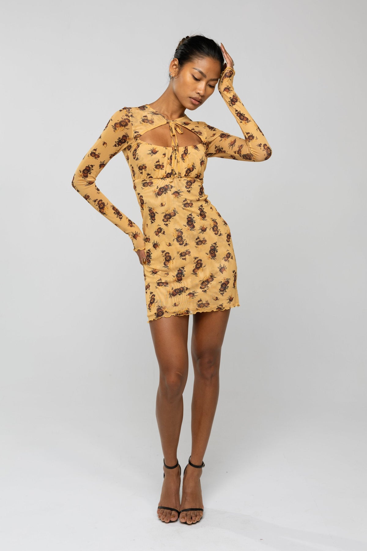 This is an image of Laurel Mini in Dandelion - RESA featuring a model wearing the dress