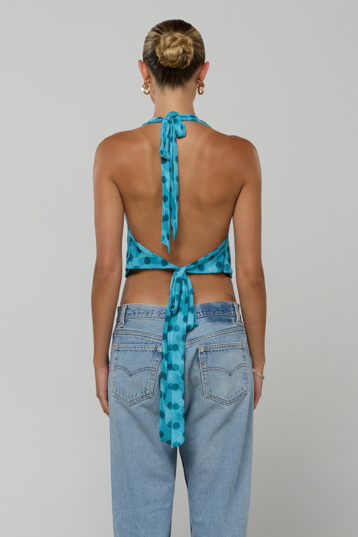This is an image of Lea in Aquamarine - RESA featuring a model wearing the dress