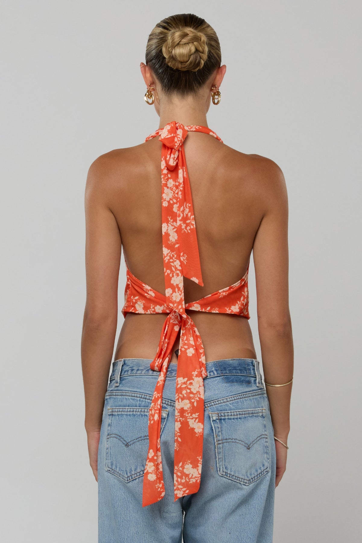 This is an image of Lea Top in Orange Blossom - RESA featuring a model wearing the dress