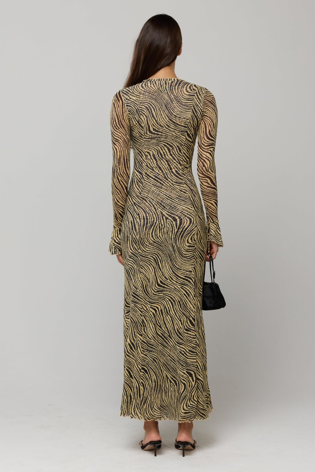 This is an image of Lennon Maxi in Birch - RESA featuring a model wearing the dress
