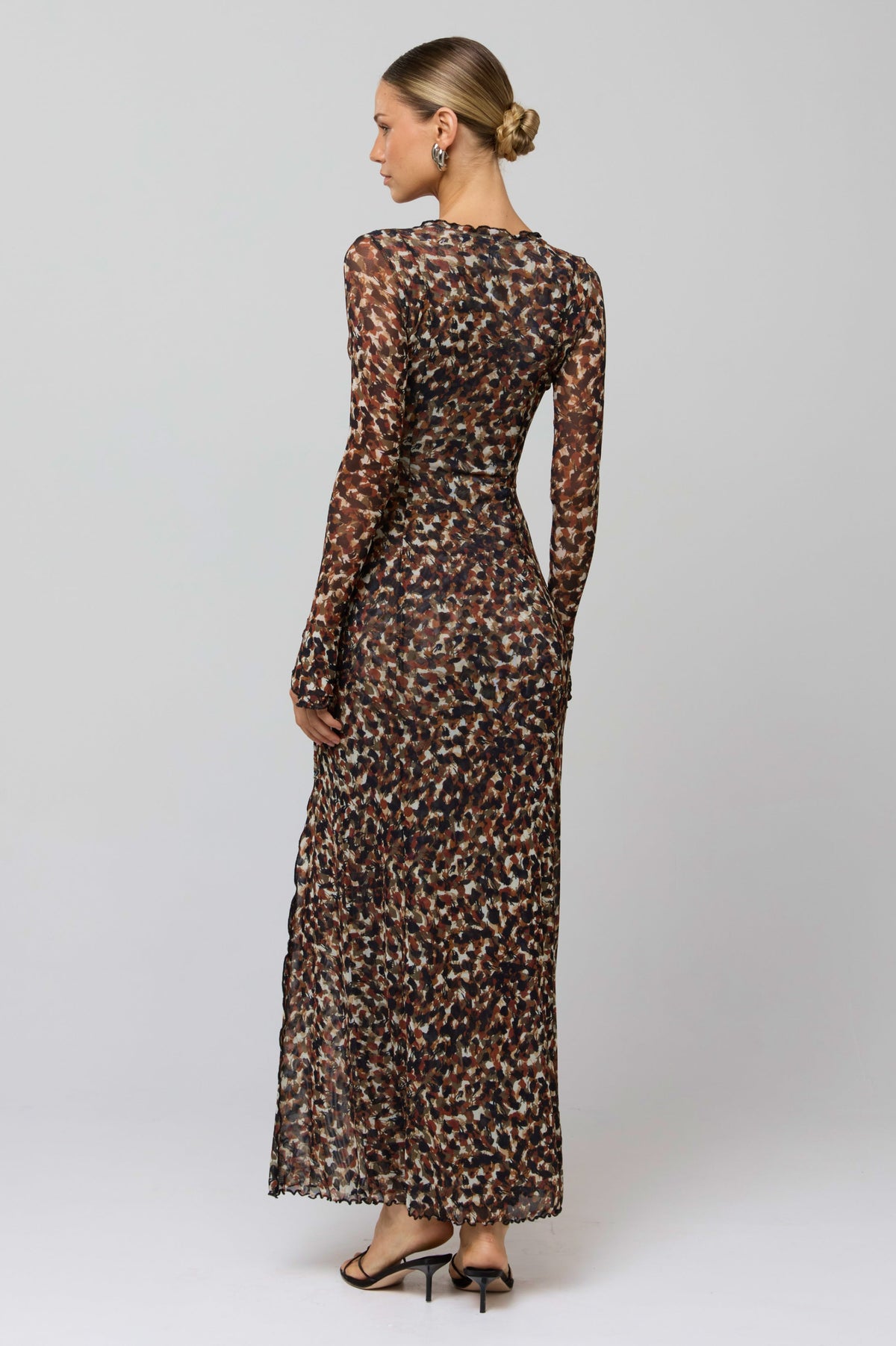 This is an image of Lennon Maxi in Terra - RESA featuring a model wearing the dress