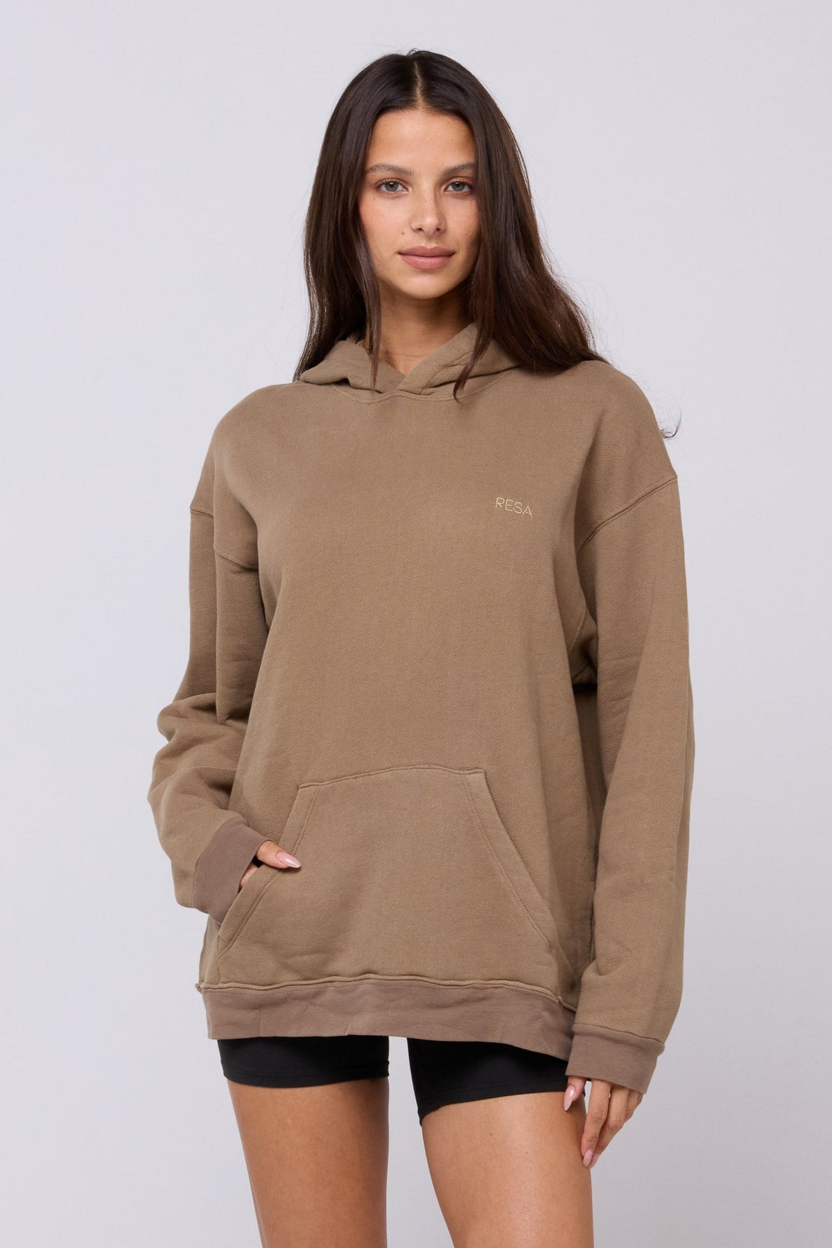 This is an image of Leo Hoodie in Moss - RESA featuring a model wearing the dress