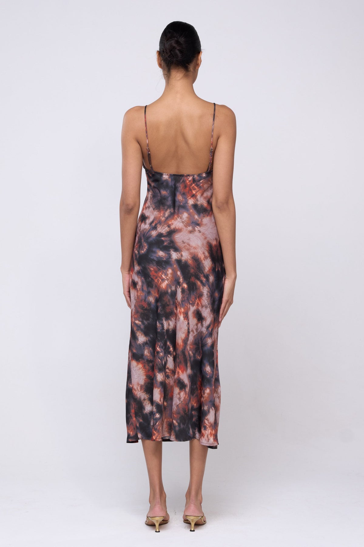 This is an image of Lily Slip in Onyx - Archive - RESA featuring a model wearing the dress