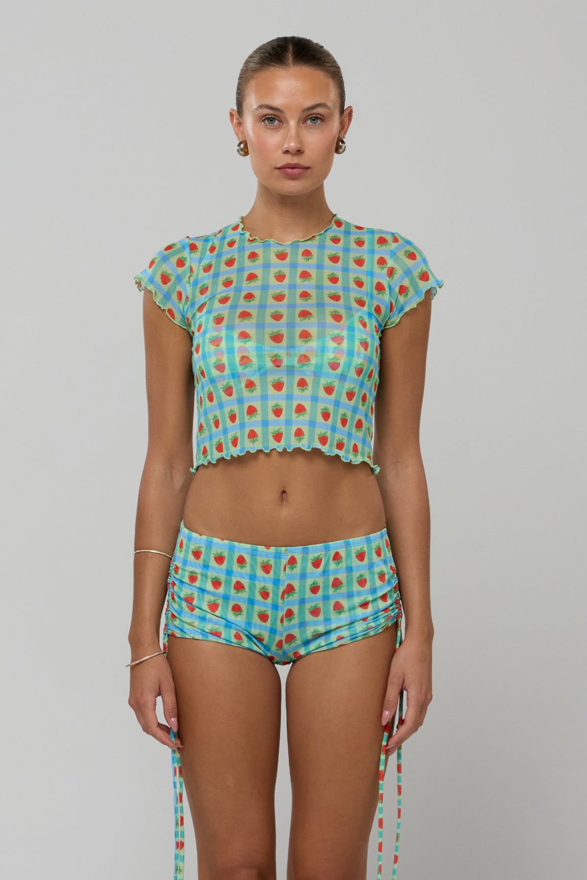 This is an image of Lina Short in Juicy - RESA featuring a model wearing the dress