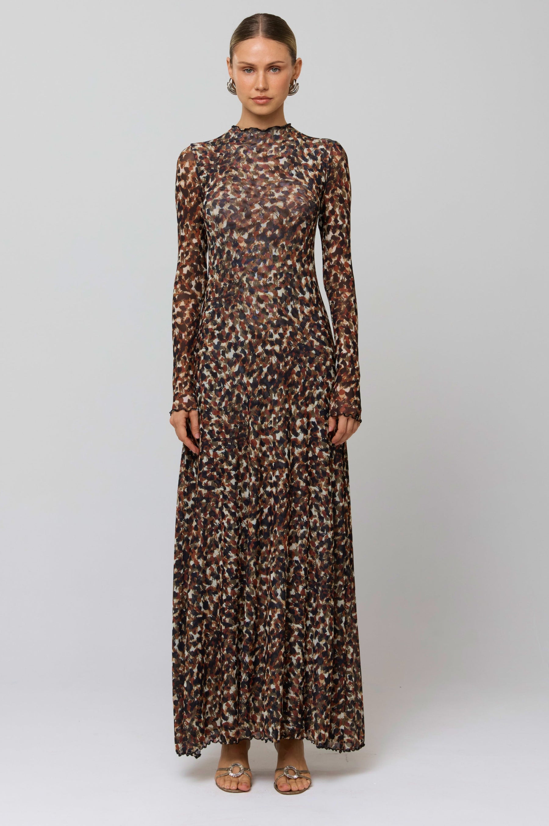 This is an image of Lyon Dress in Terra - RESA featuring a model wearing the dress