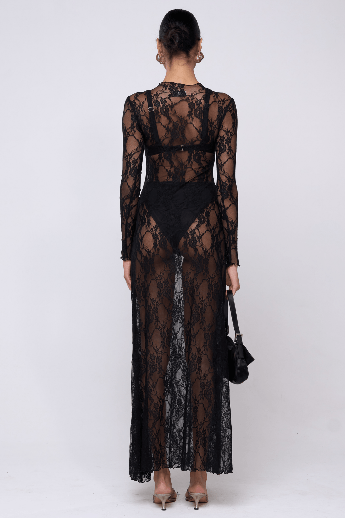 This is an image of Lyon Lace Dress in Black Lace - RESA featuring a model wearing the dress