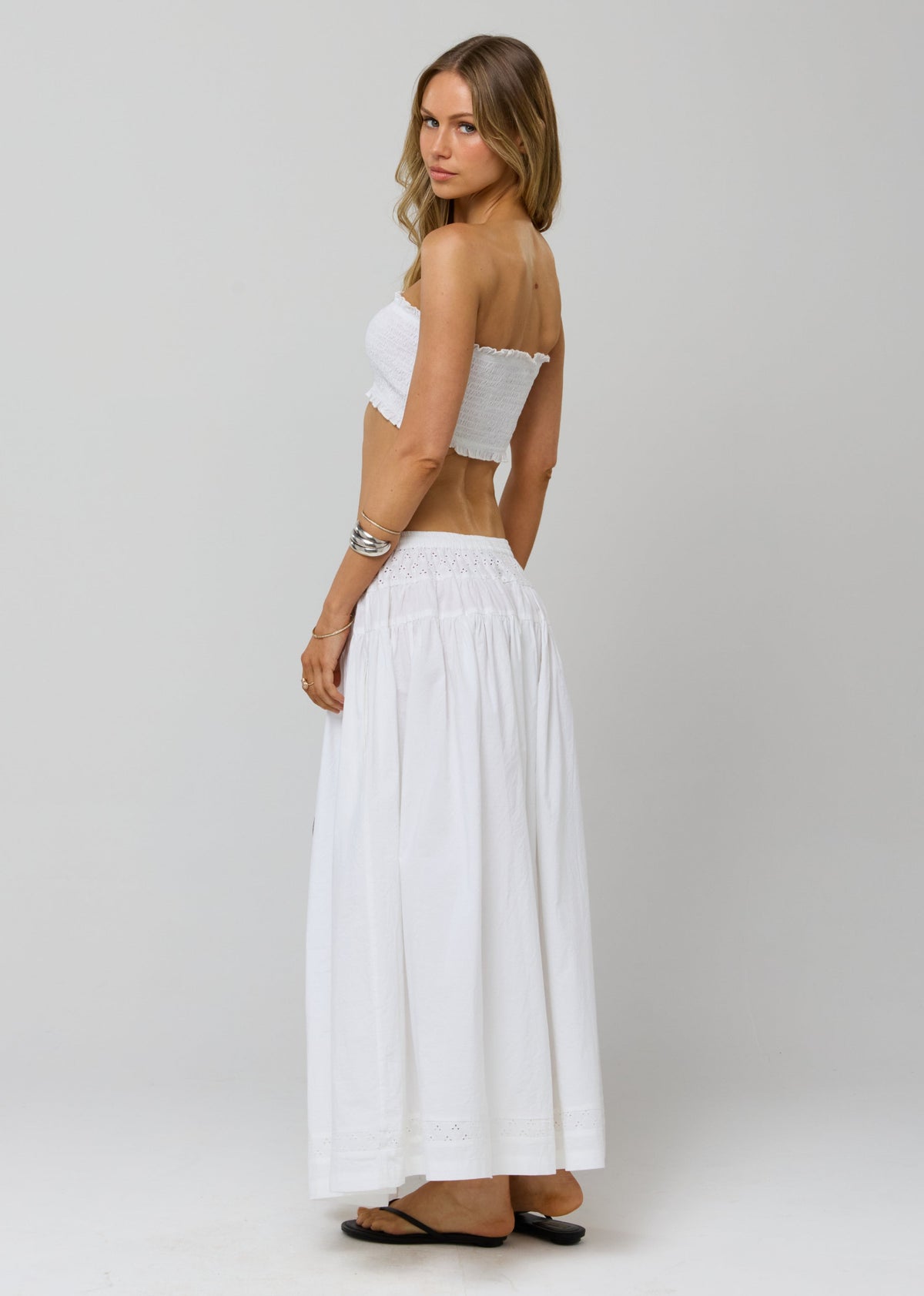 This is an image of Lyssa Set in White Eyelet - RESA featuring a model wearing the dress