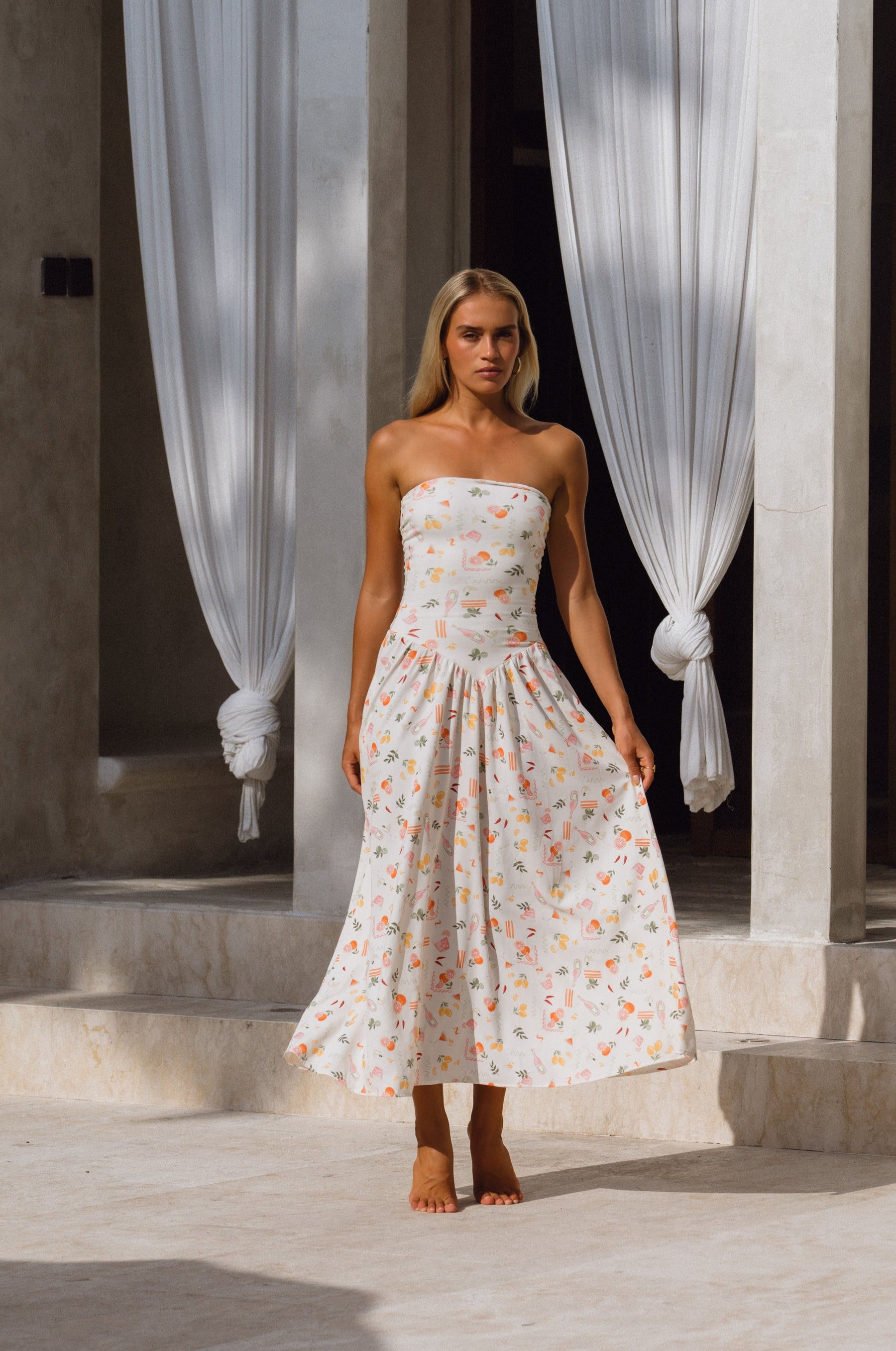 This is an image of Mackenzie Dress in Aperitivo - RESA featuring a model wearing the dress