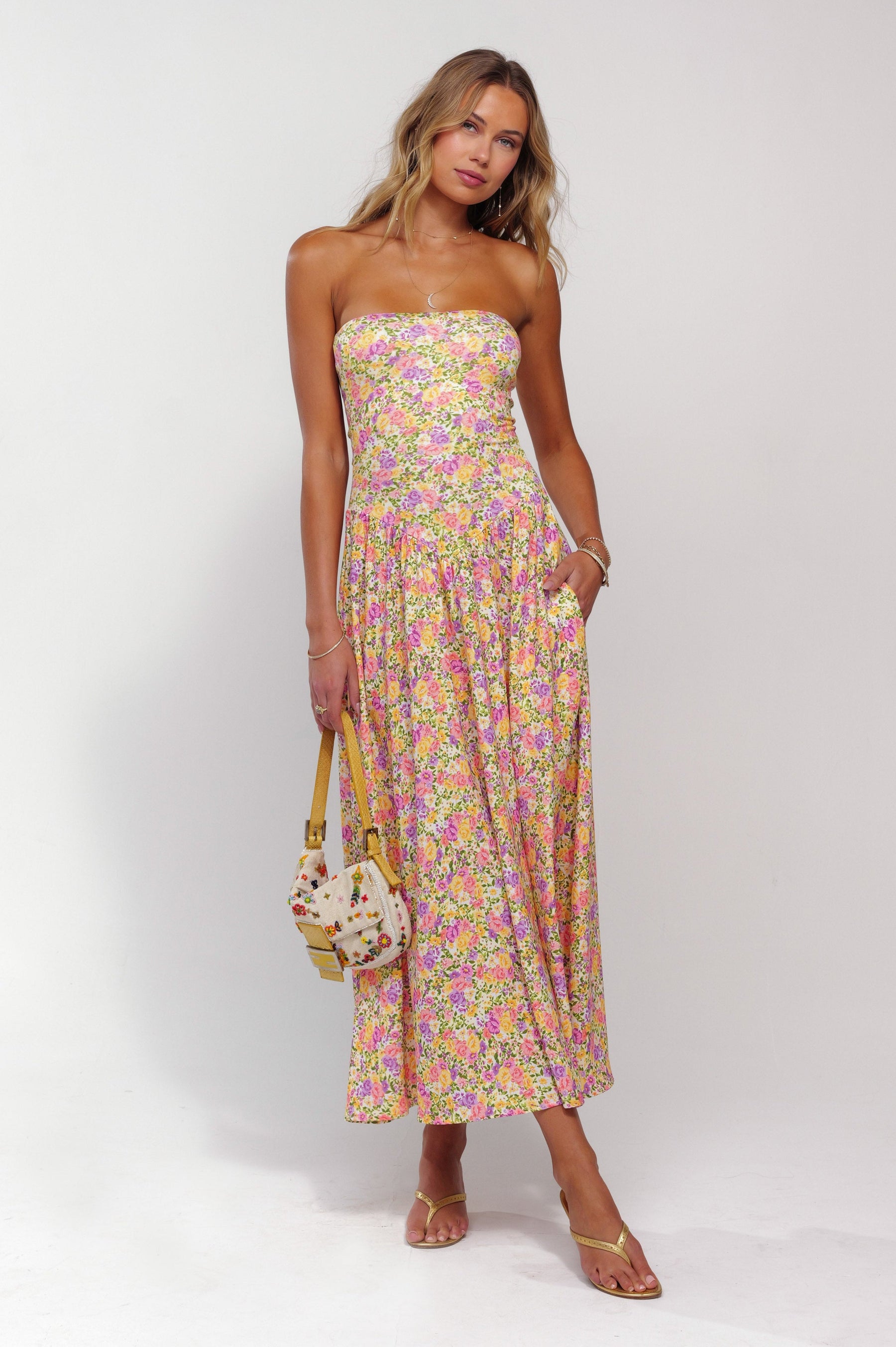 This is an image of Mackenzie Dress in April - RESA featuring a model wearing the dress