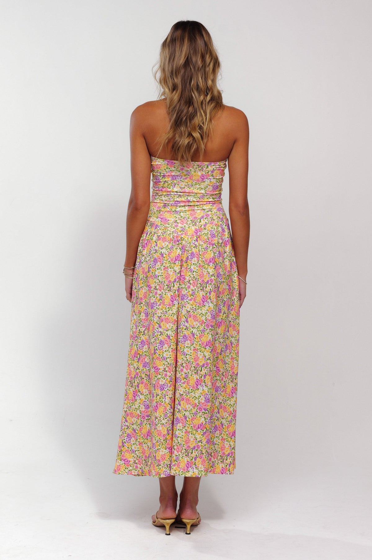 This is an image of Mackenzie Dress in April - RESA featuring a model wearing the dress