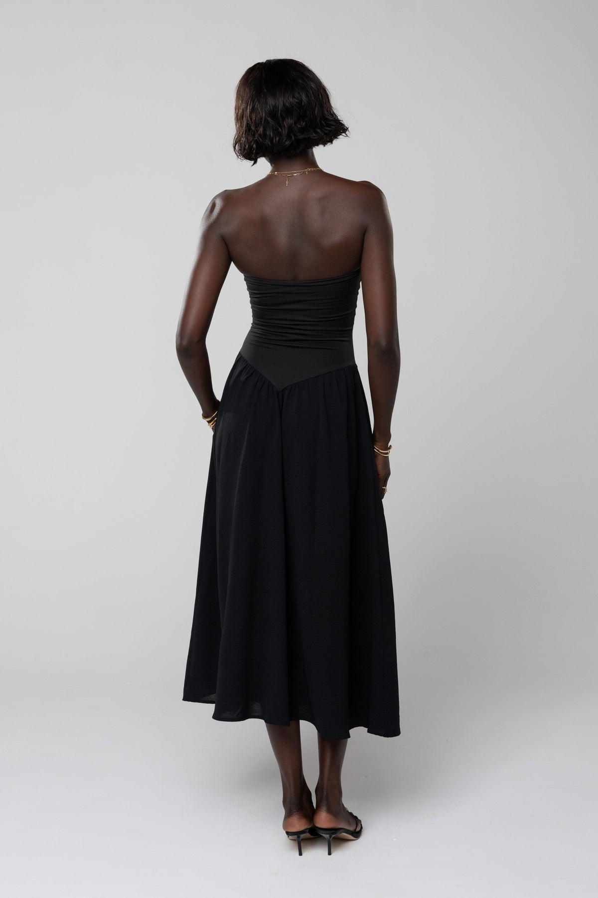 This is an image of Mackenzie Dress in Black - RESA featuring a model wearing the dress