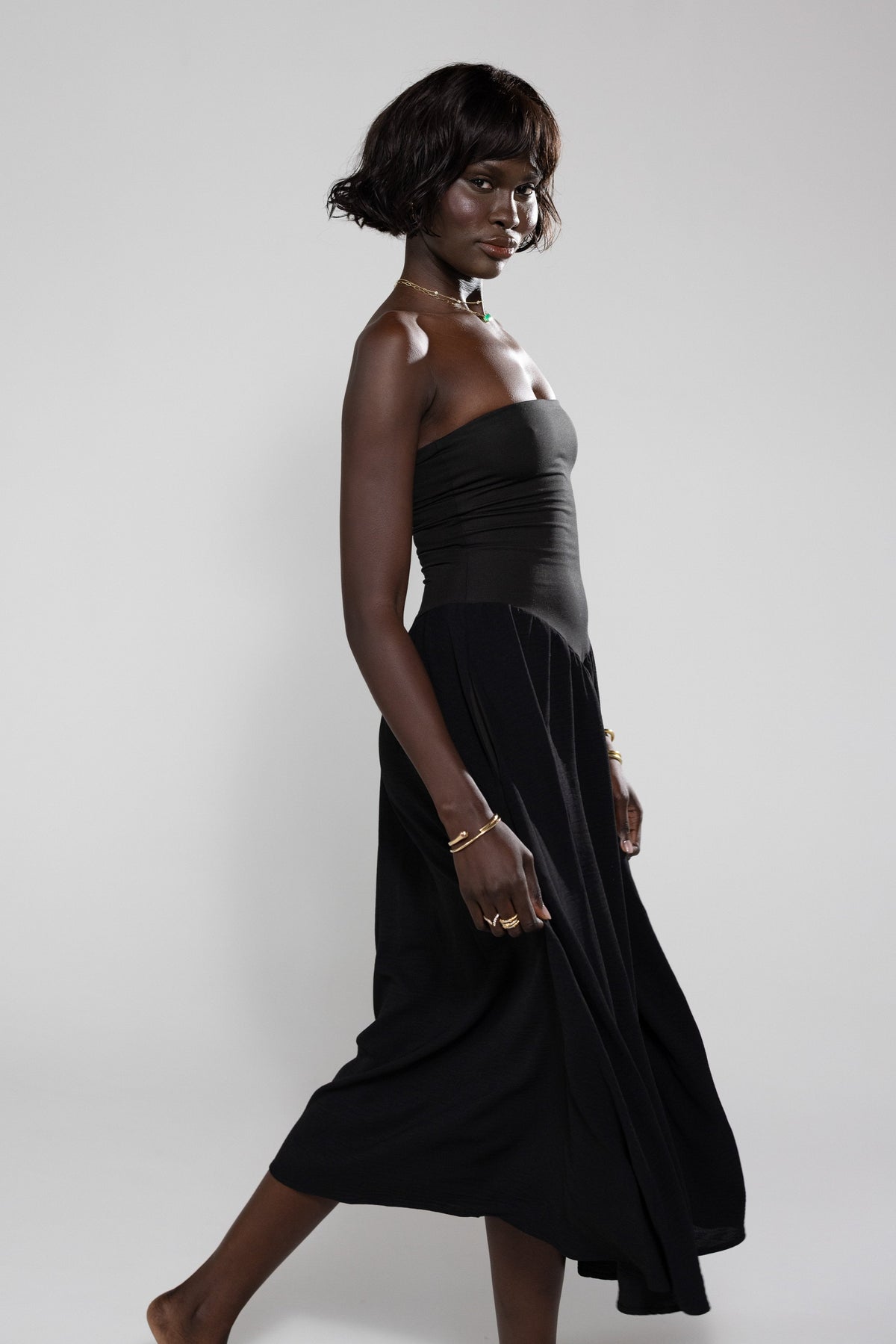 This is an image of Mackenzie Dress in Black - RESA featuring a model wearing the dress