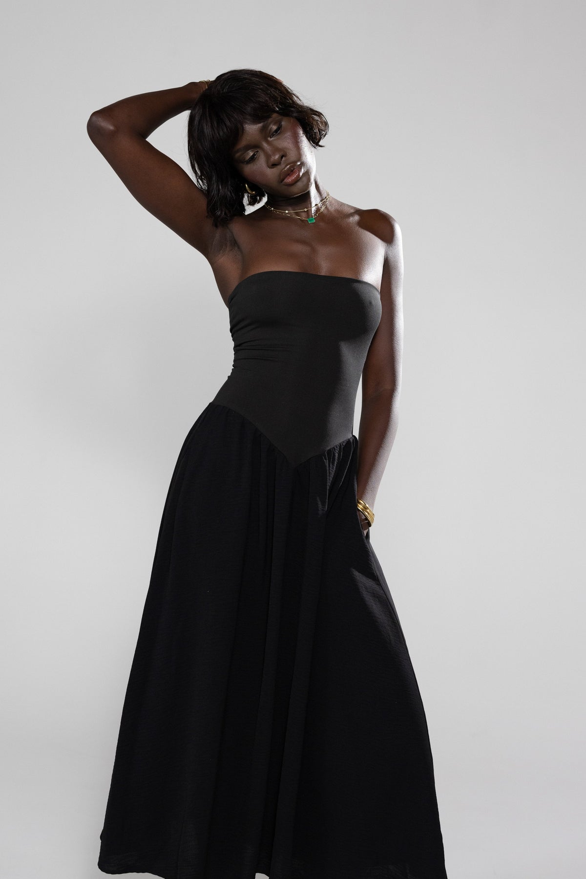 This is an image of Mackenzie Dress in Black - RESA featuring a model wearing the dress