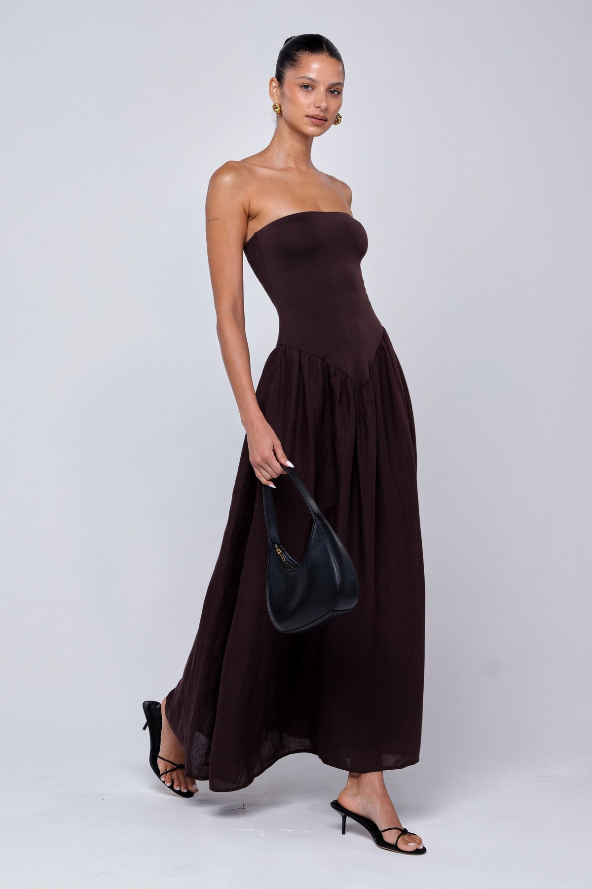 This is an image of Mackenzie Dress in Brown Linen - RESA featuring a model wearing the dress