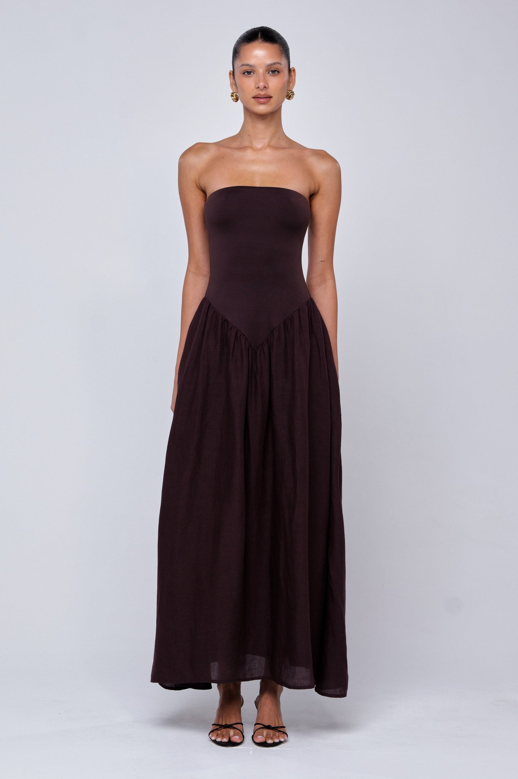 This is an image of Mackenzie Dress in Brown Linen - RESA featuring a model wearing the dress