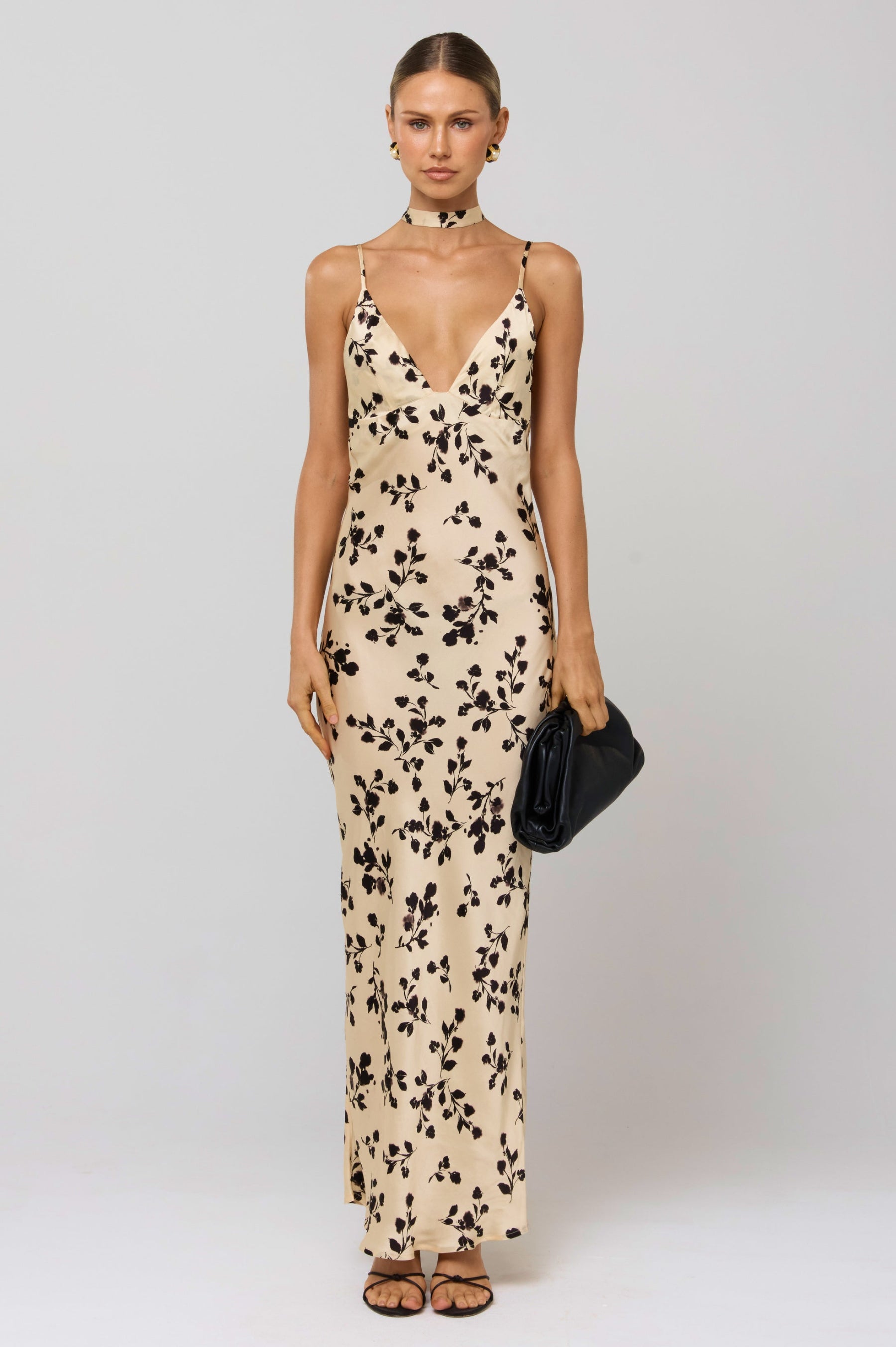 This is an image of Madeline Dress in Black Dahlia - RESA featuring a model wearing the dress