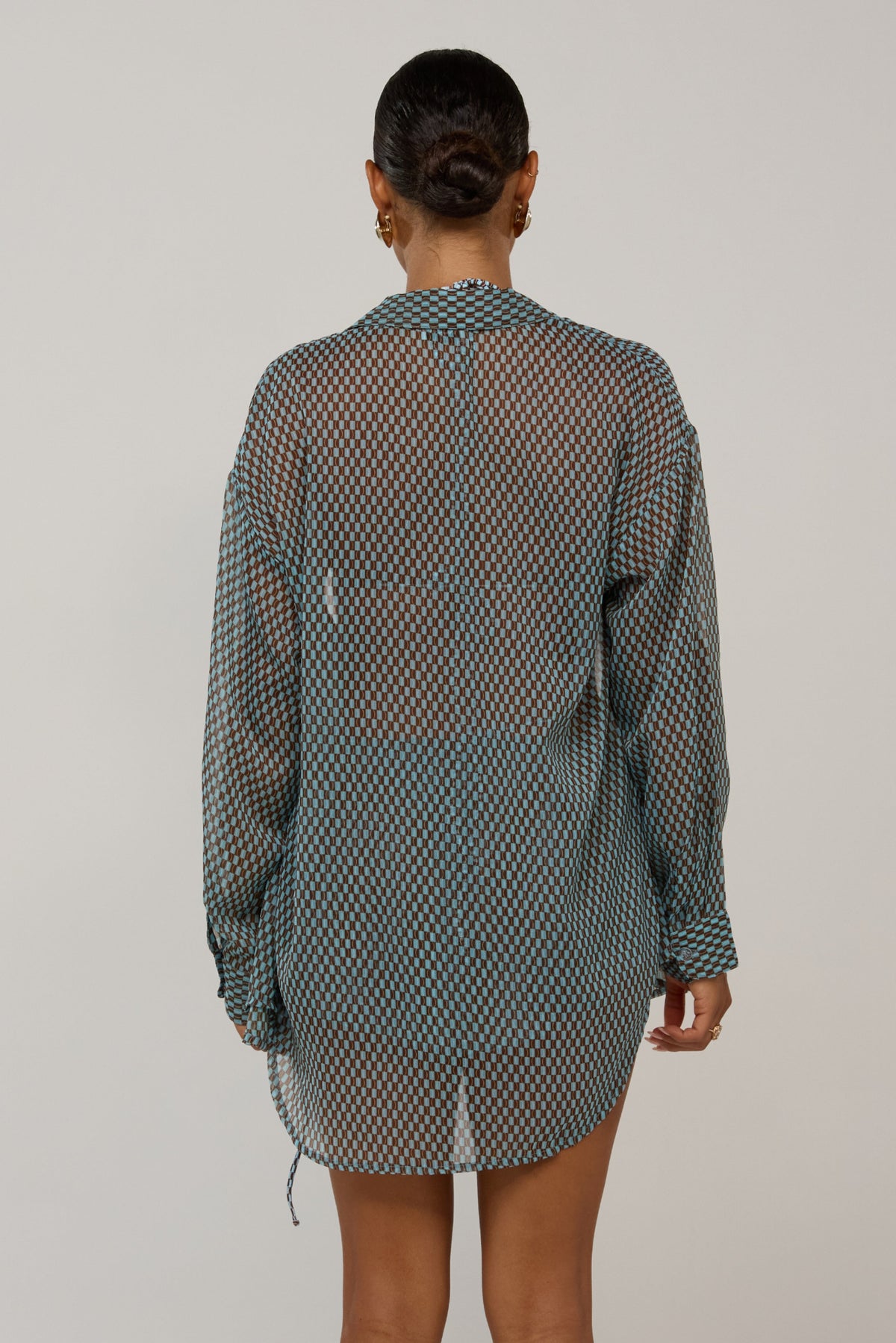This is an image of Maggie in Swell - RESA featuring a model wearing the dress