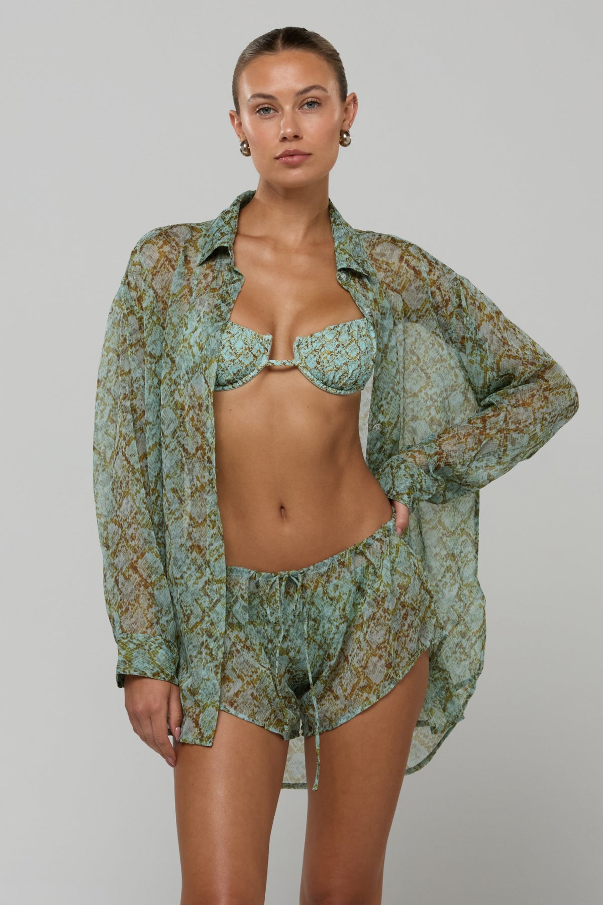 This is an image of Maggie set in Azura - RESA featuring a model wearing the dress