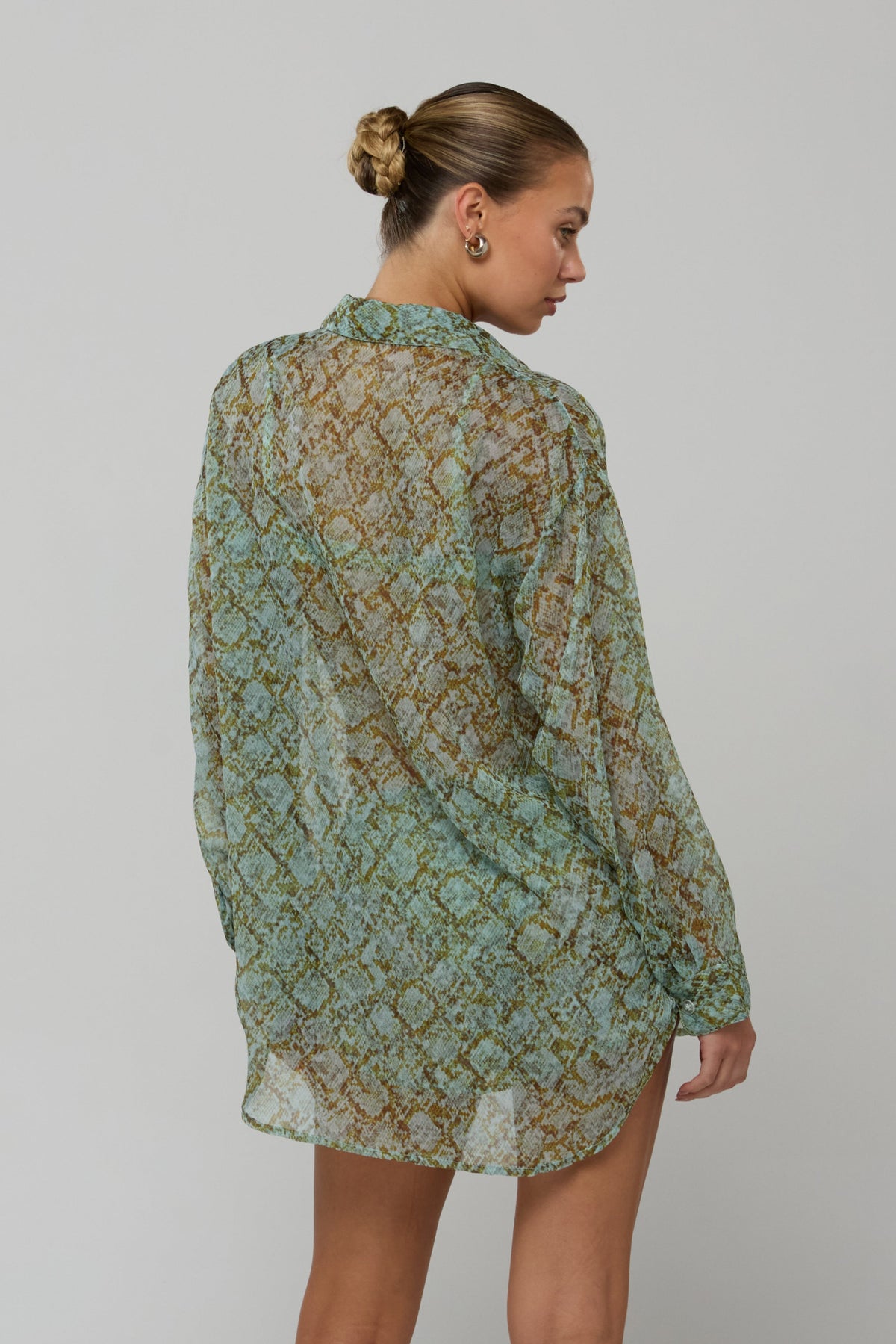This is an image of Maggie set in Azura - RESA featuring a model wearing the dress