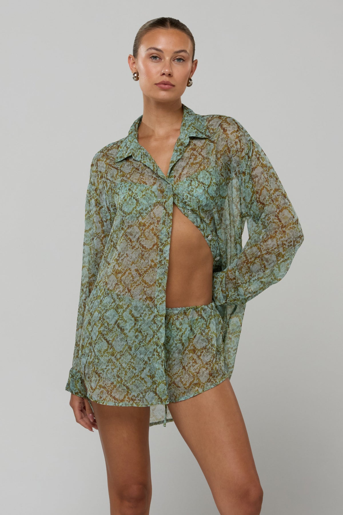 This is an image of Maggie set in Azura - RESA featuring a model wearing the dress