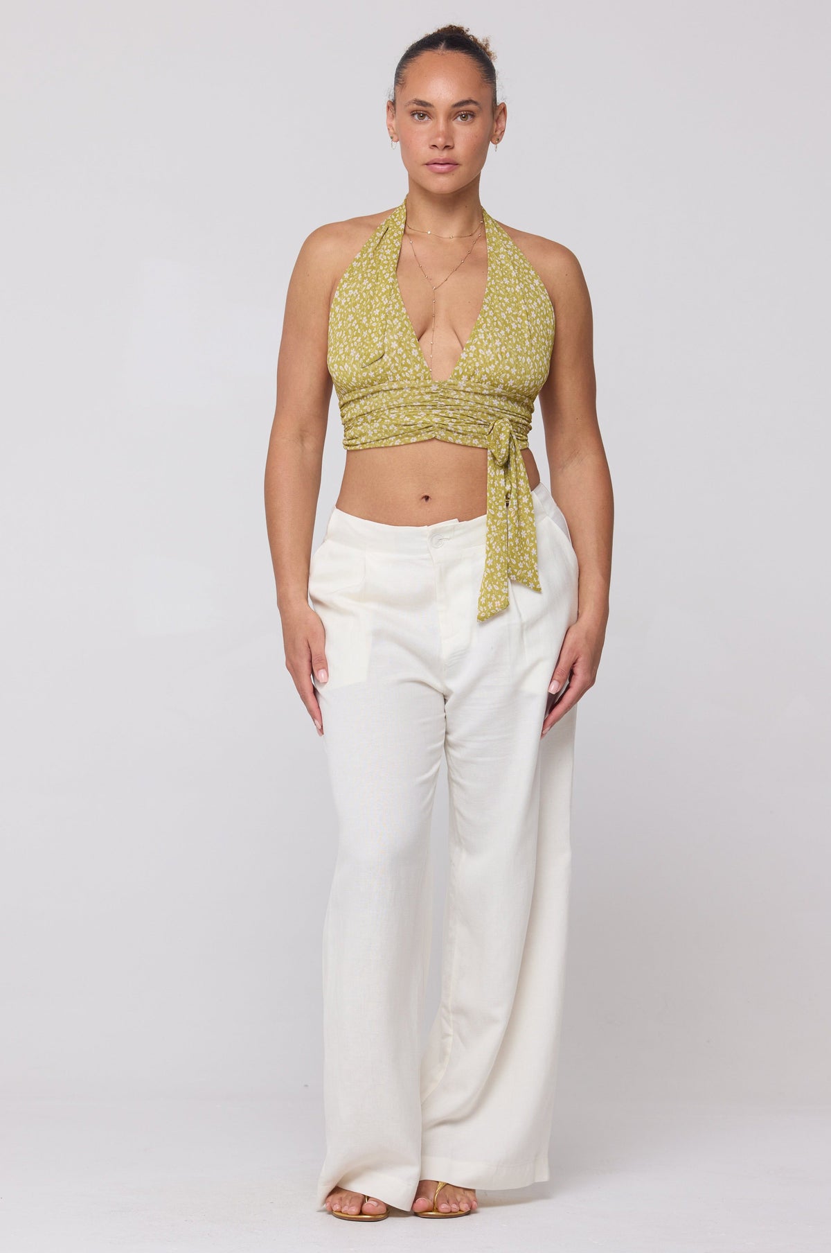 This is an image of Malcolm Trousers in White Linen - RESA featuring a model wearing the dress