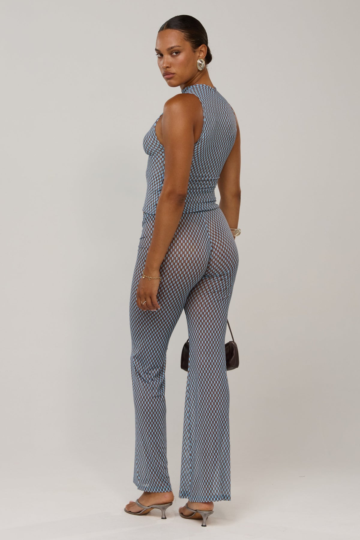 This is an image of Mallory in Swell - RESA featuring a model wearing the dress