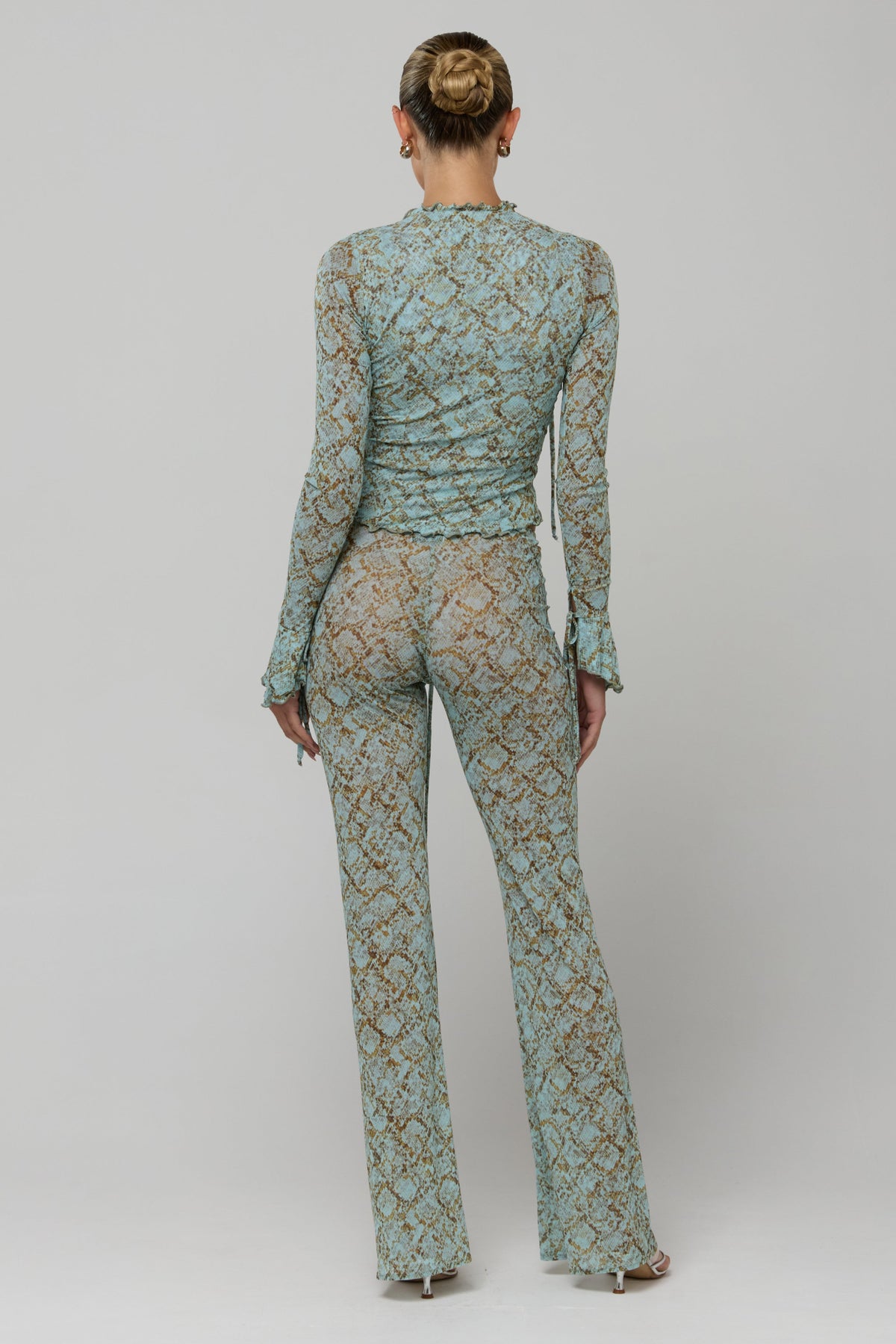 This is an image of Mallory Pant in Azura - RESA featuring a model wearing the dress