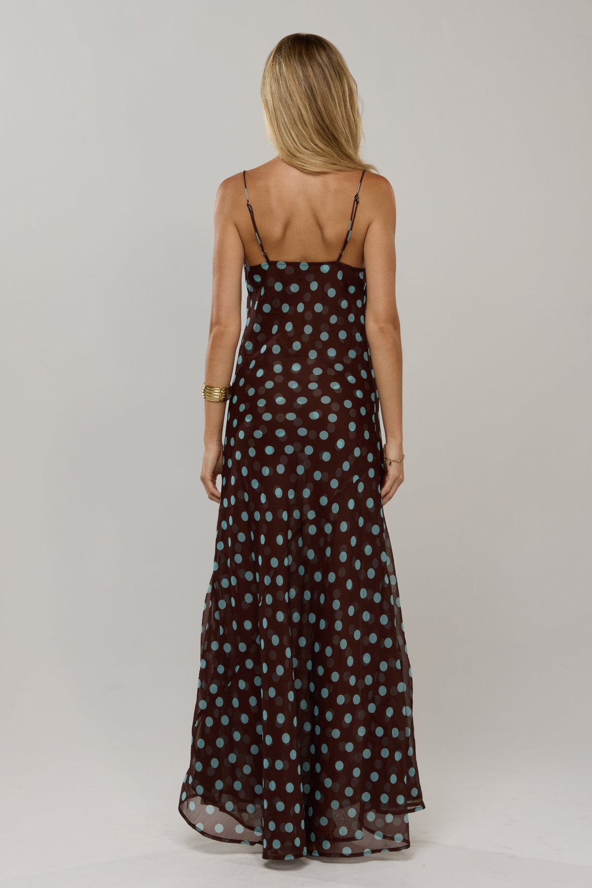 This is an image of Margot in Costa - RESA featuring a model wearing the dress