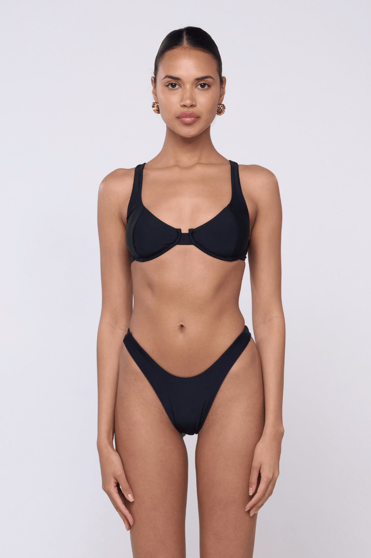 This is an image of Matty Bikini Top in Black - RESA featuring a model wearing the dress