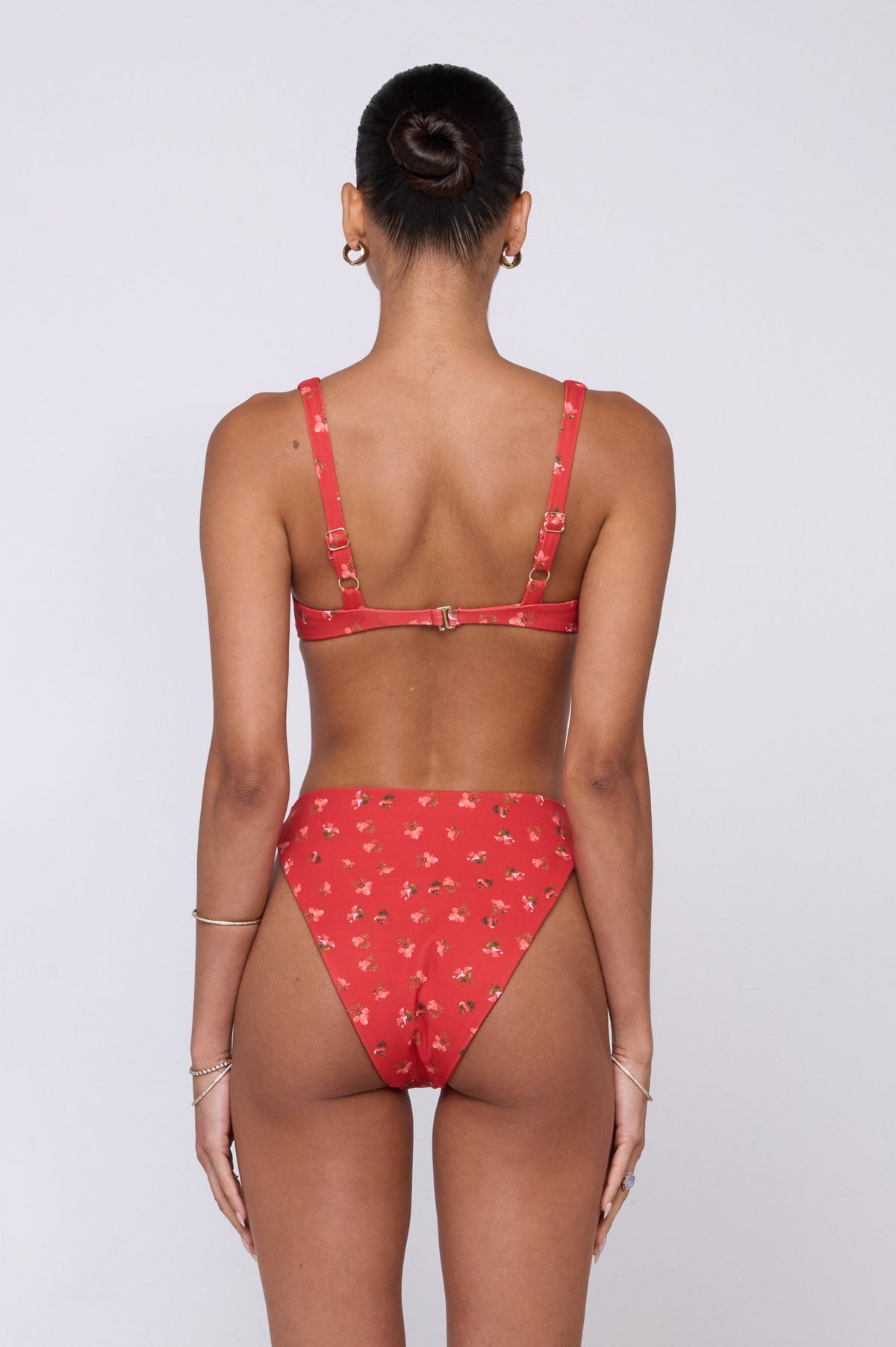 This is an image of Matty Bikini Top in Cayenne - RESA featuring a model wearing the dress