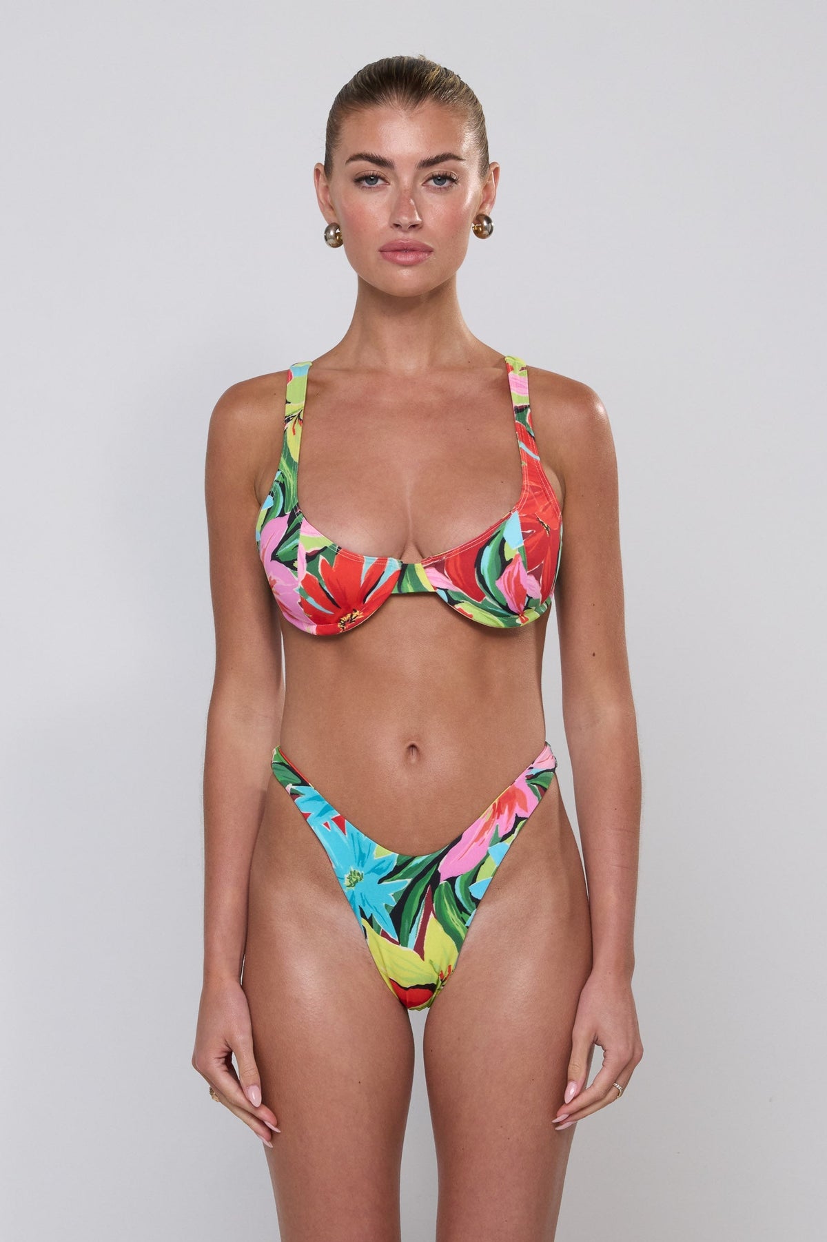 This is an image of Matty Bikini Top in Tropicana - RESA featuring a model wearing the dress