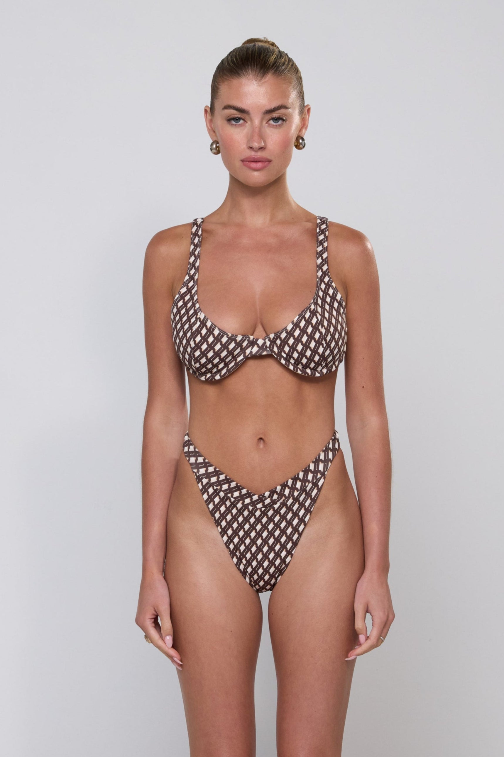 This is an image of Matty Bikini Top in Tulum - RESA featuring a model wearing the dress