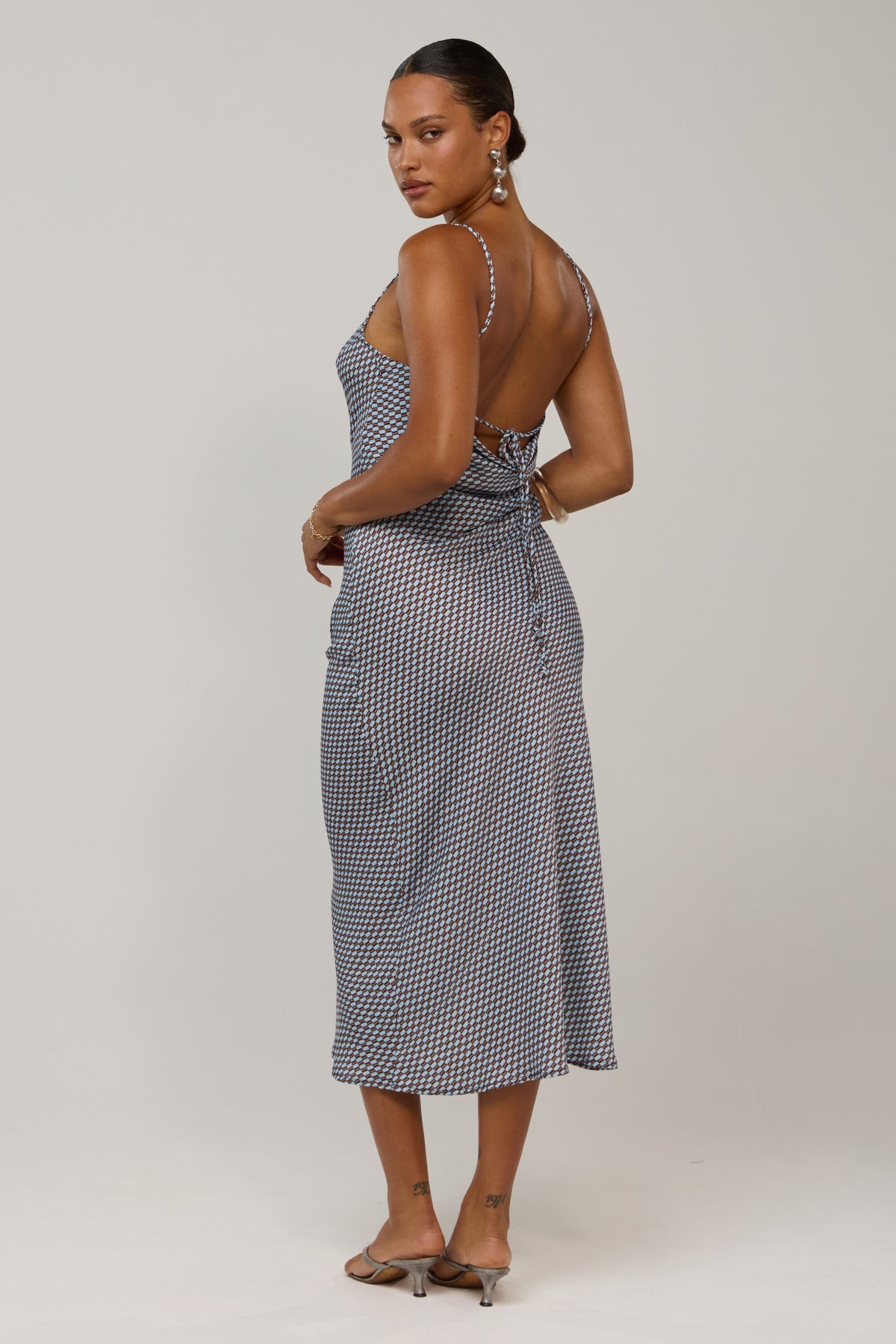 This is an image of Meryl in Swell - RESA featuring a model wearing the dress