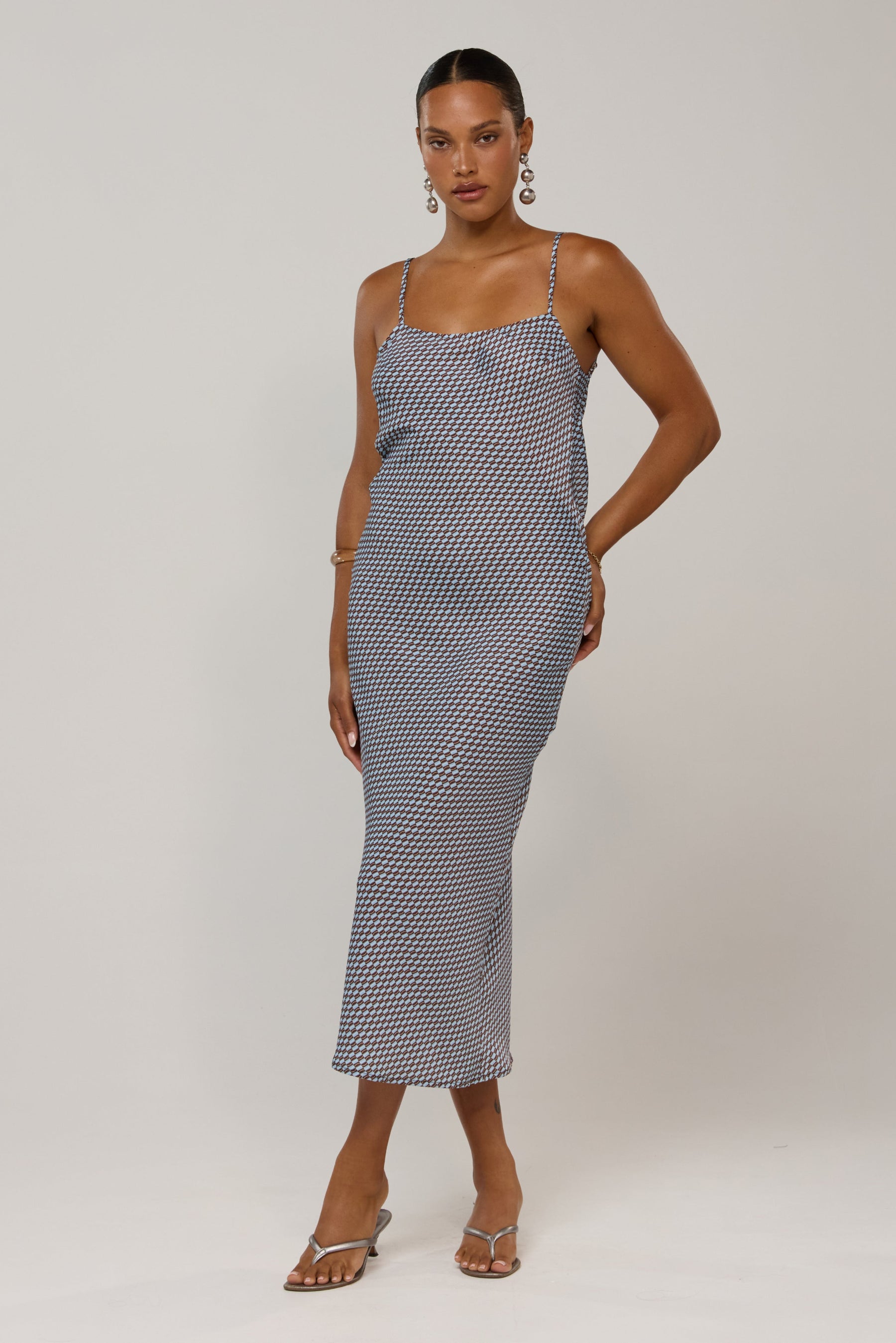 This is an image of Meryl in Swell - RESA featuring a model wearing the dress