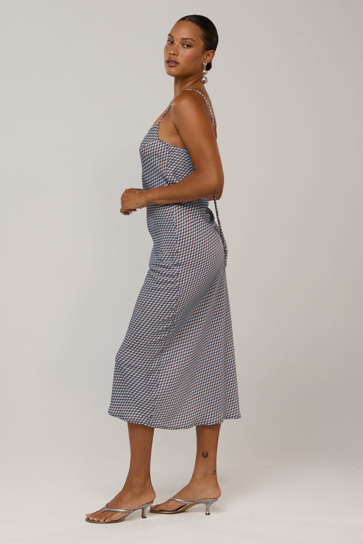 This is an image of Meryl in Swell - RESA featuring a model wearing the dress